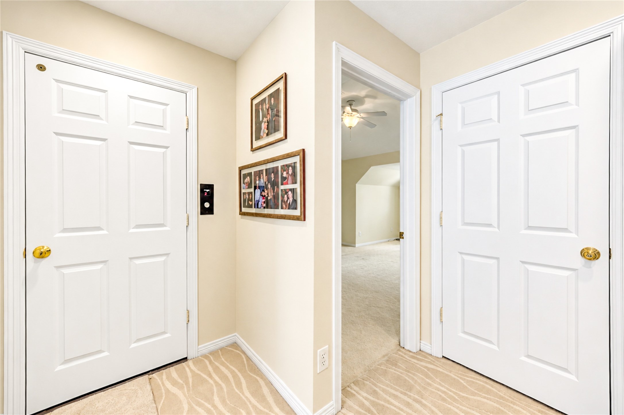 An elevator serving all three floors provides convenient access to the home's third-floor living accommodations.