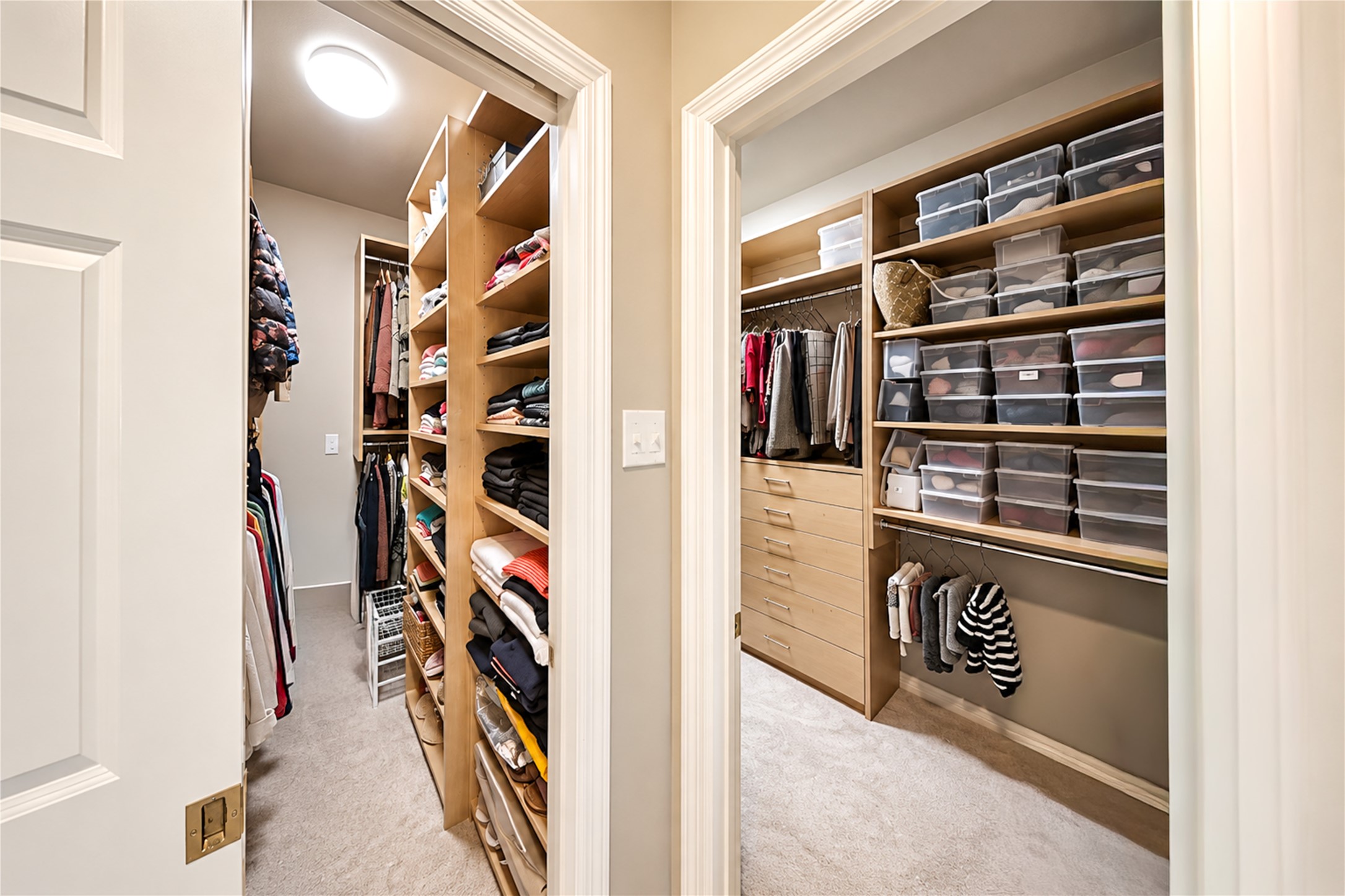 Custom closets with built-in shelving, drawers and hanging space offer abundant, well-organized storage.