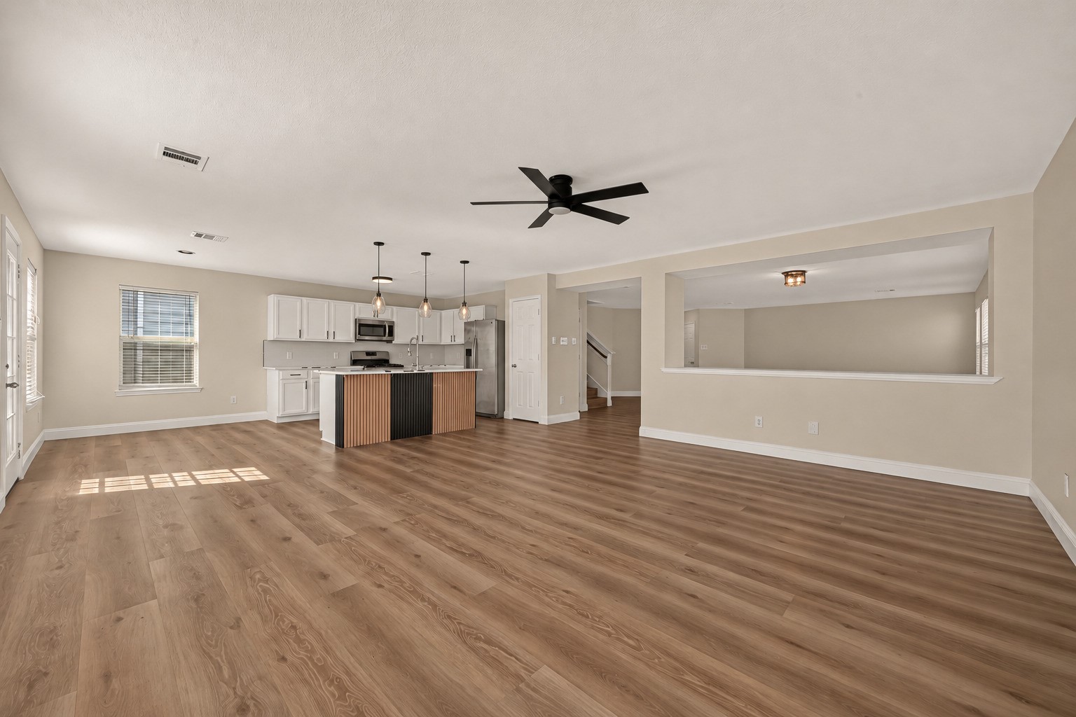 This generous open-concept space offers versatility for everyday routines, casual meals, and gatherings that extend beyond the dining table.
