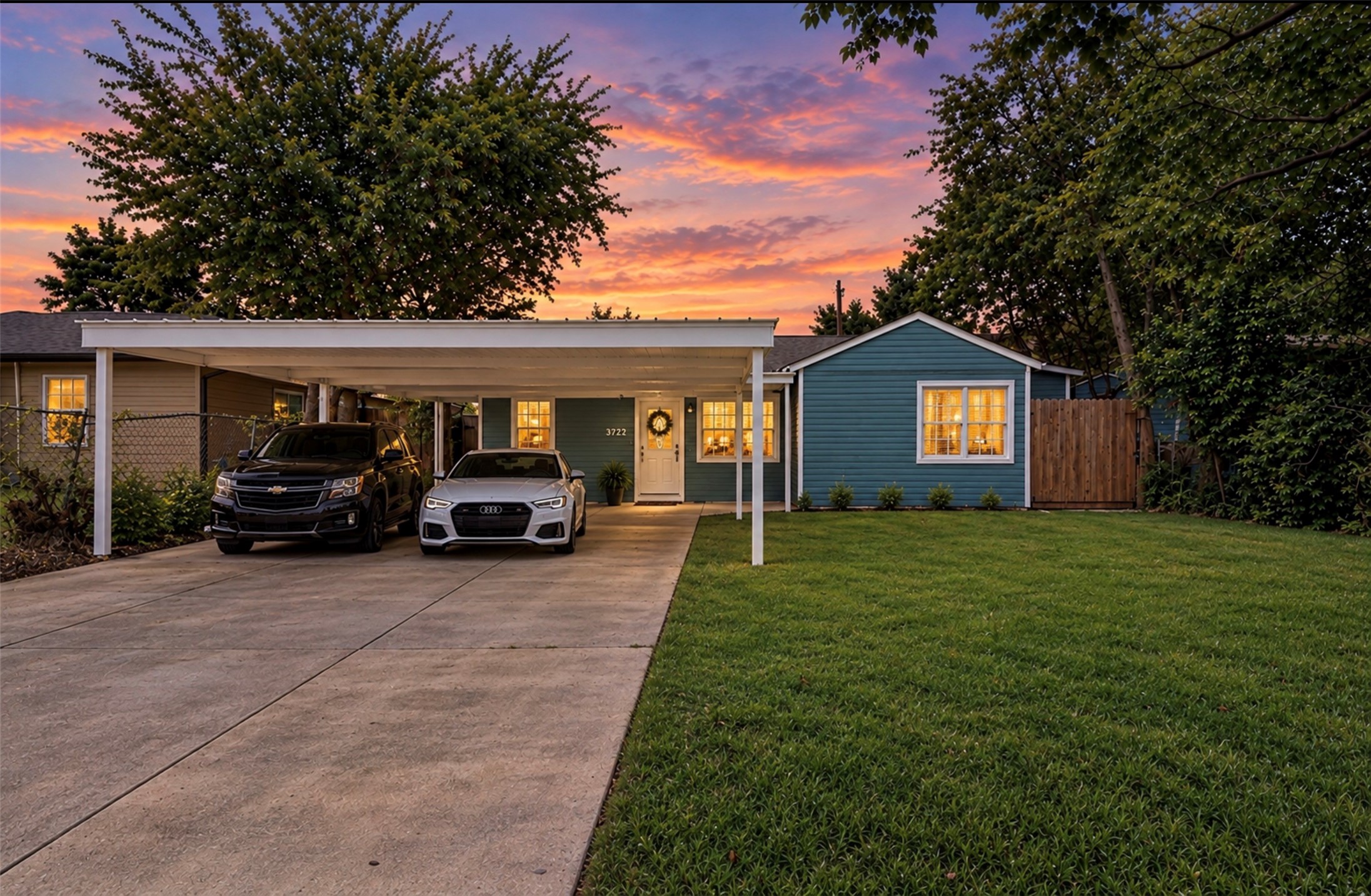 Photoshopped/Enhanced Photo (twilight): Front view of this beautifully remodeled home showcasing ample driveway parking and a covered carport, providing convenient shade and protection from the Texas sun while helping keep the front of the home cooler. Photoshopped/Enhanced Photo (twilight): Front view of this beautifully remodeled home showcasing ample driveway parking and a covered carport, providing convenient shade and protection from the Texas sun while helping keep the front of the home cooler.