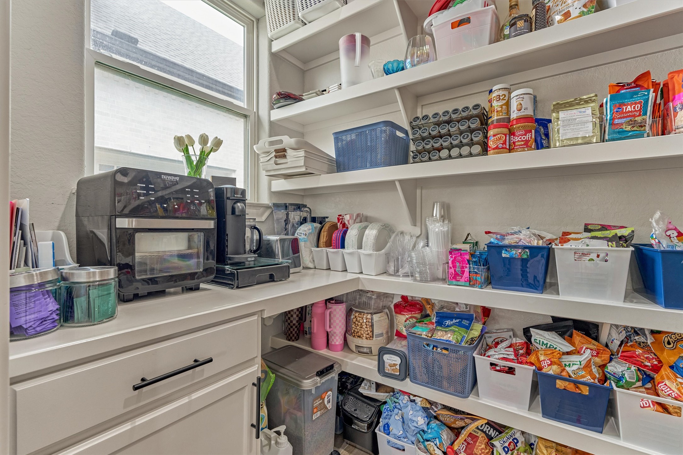 A full coffee bar area with plenty of storage space tucked away from the kitchen.