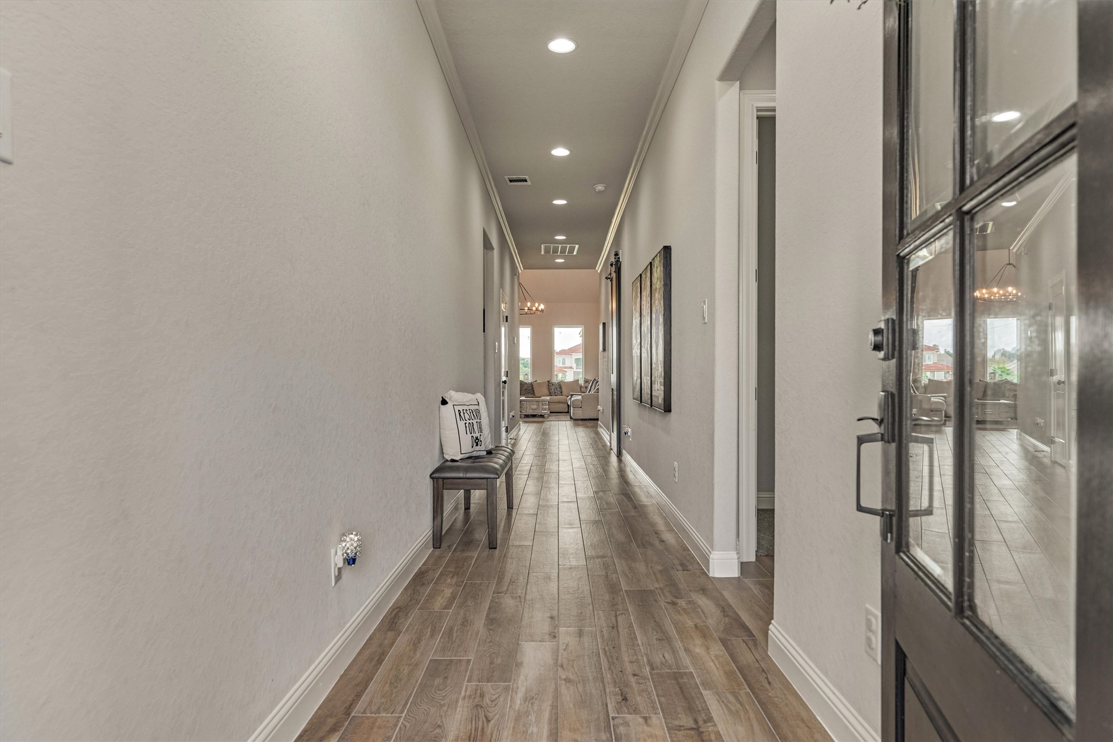 The entryway features a long hallway
