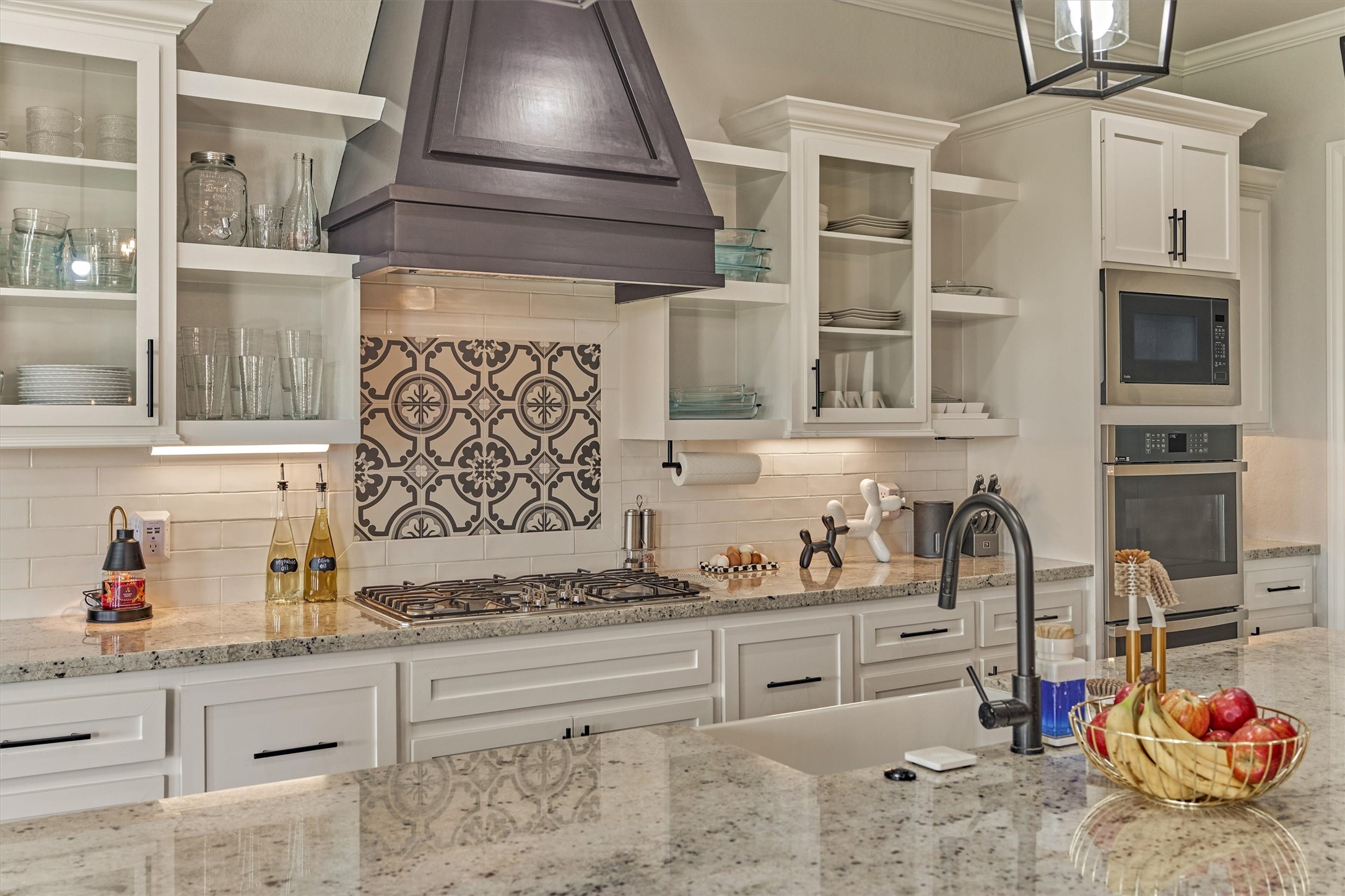 Custom lighting throughout the kitchen including under cabinet lighting.