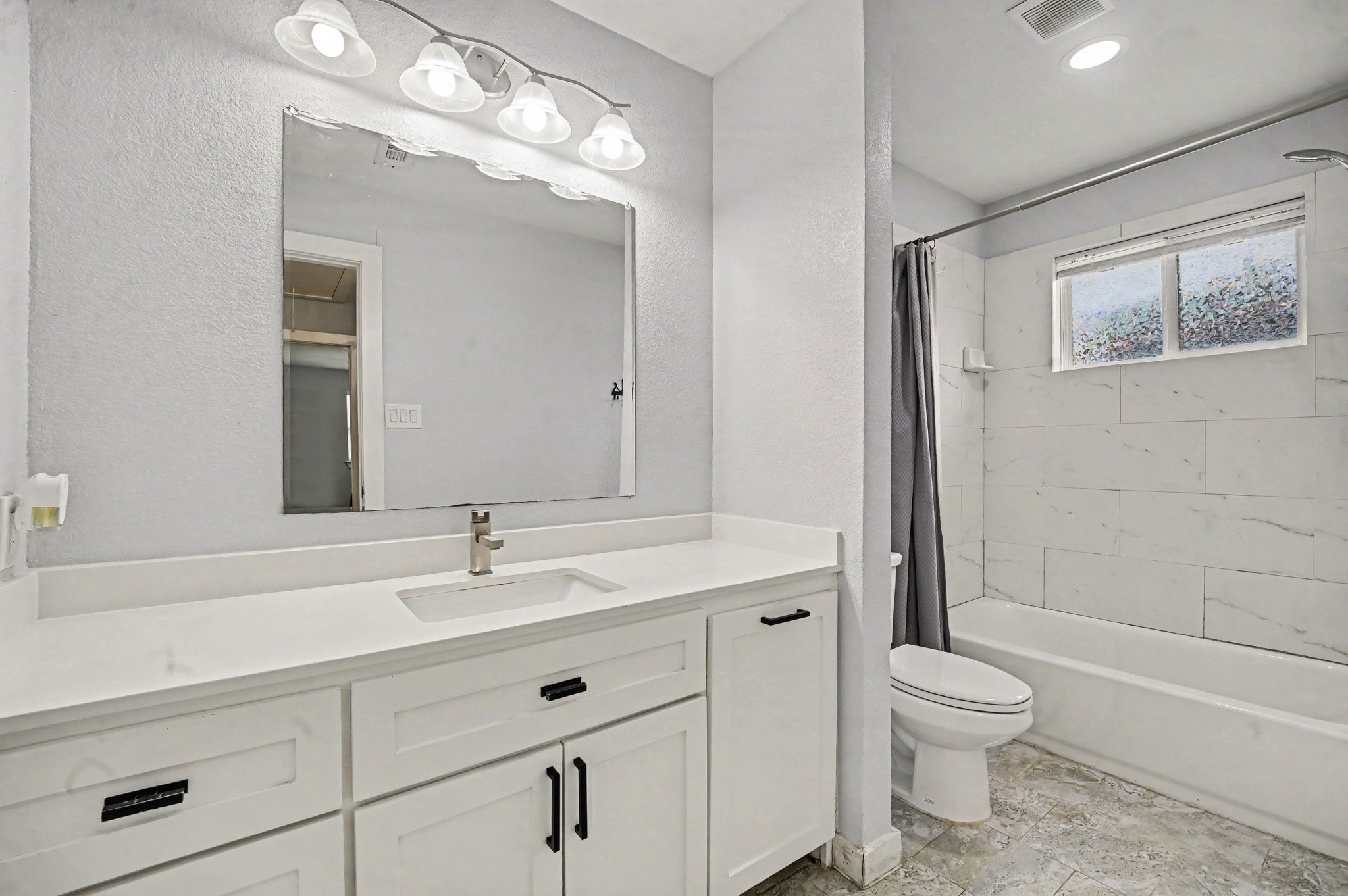 The secondary bathroom is updated and offer plenty of space and storage.