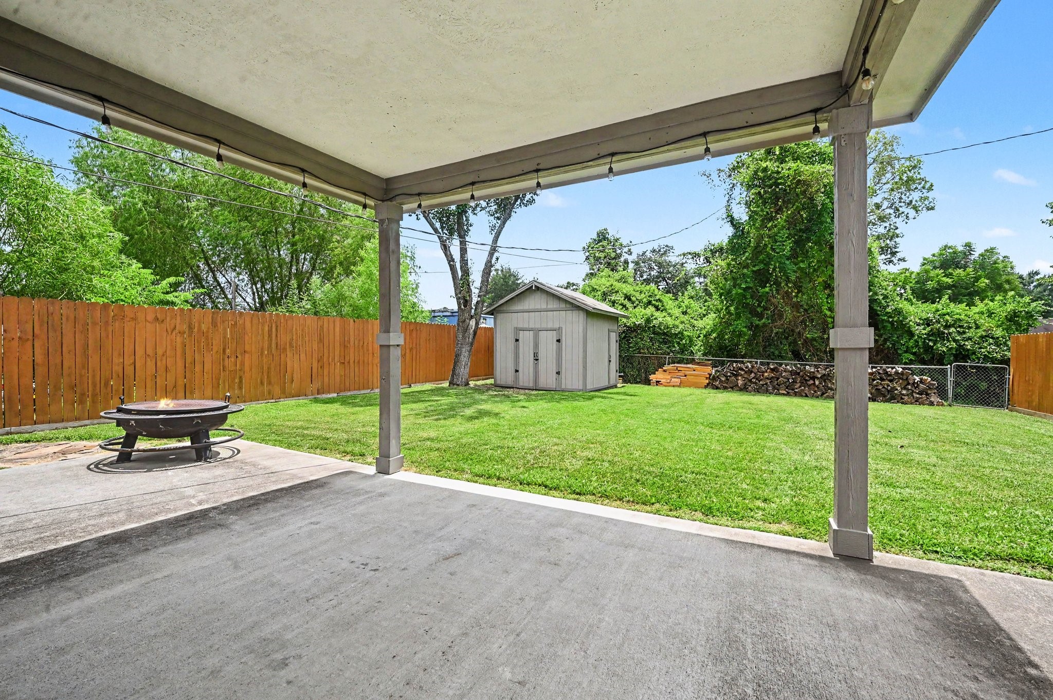 The back yard is as impressive as the home. It offers a covered patio along with privacy fence.