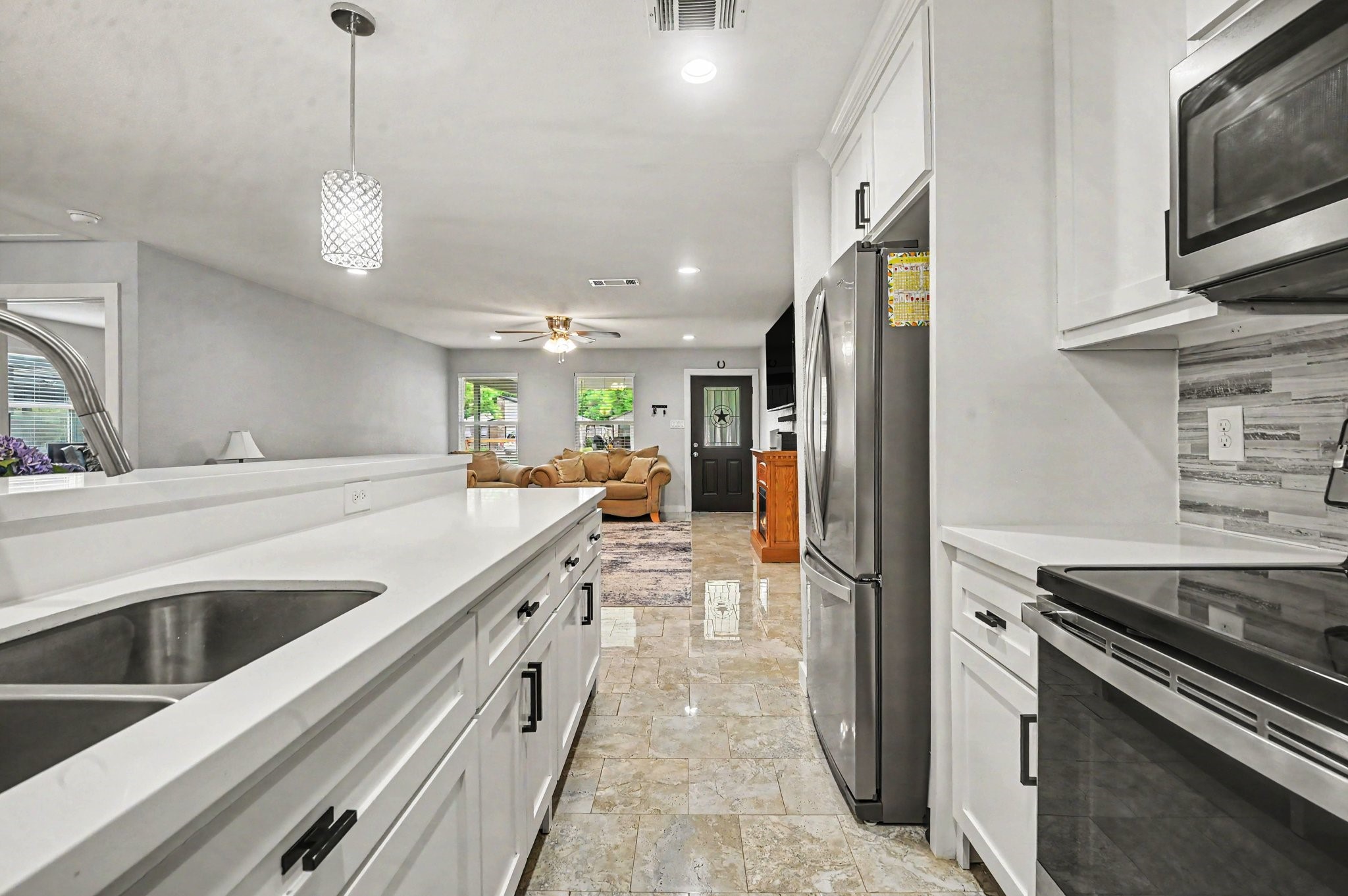 With an open concept kitchen, very generous counter top space and bar stool room for the entire length of the kitchen peninsula, the home is perfect for family gatherings and entertainment.