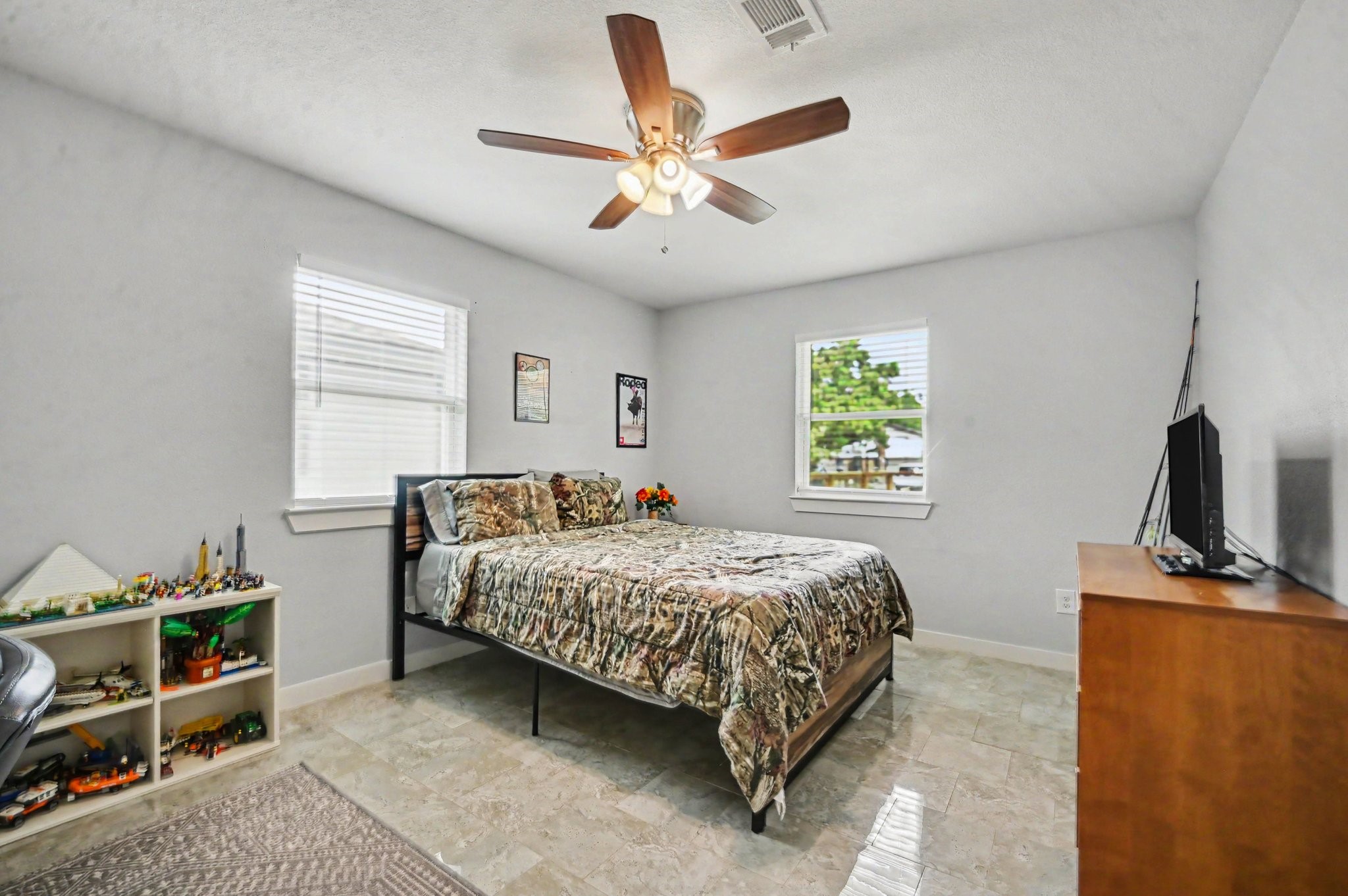 The secondary bedroom is situated on the opposite side of the home from the master bedroom and offers a generous space along with a generous closet with plenty of storage.