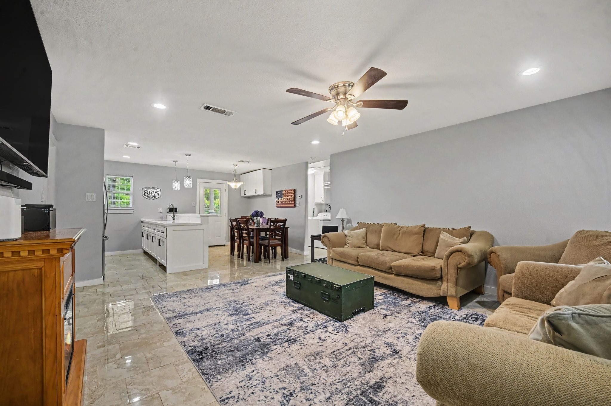 The home welcomes you with a open concept, with a generous spaced living area, open kitchen and easy access to the back yard.