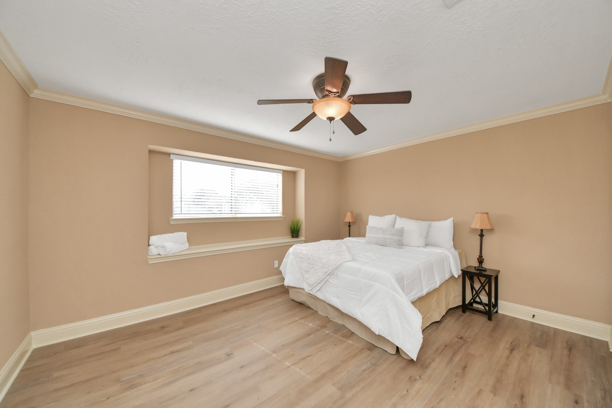 The recessed window with an extended ledge adds architectural character and provides a lovely spot for decorative accents. A comfortable space to relax and recharge at the end of the day.