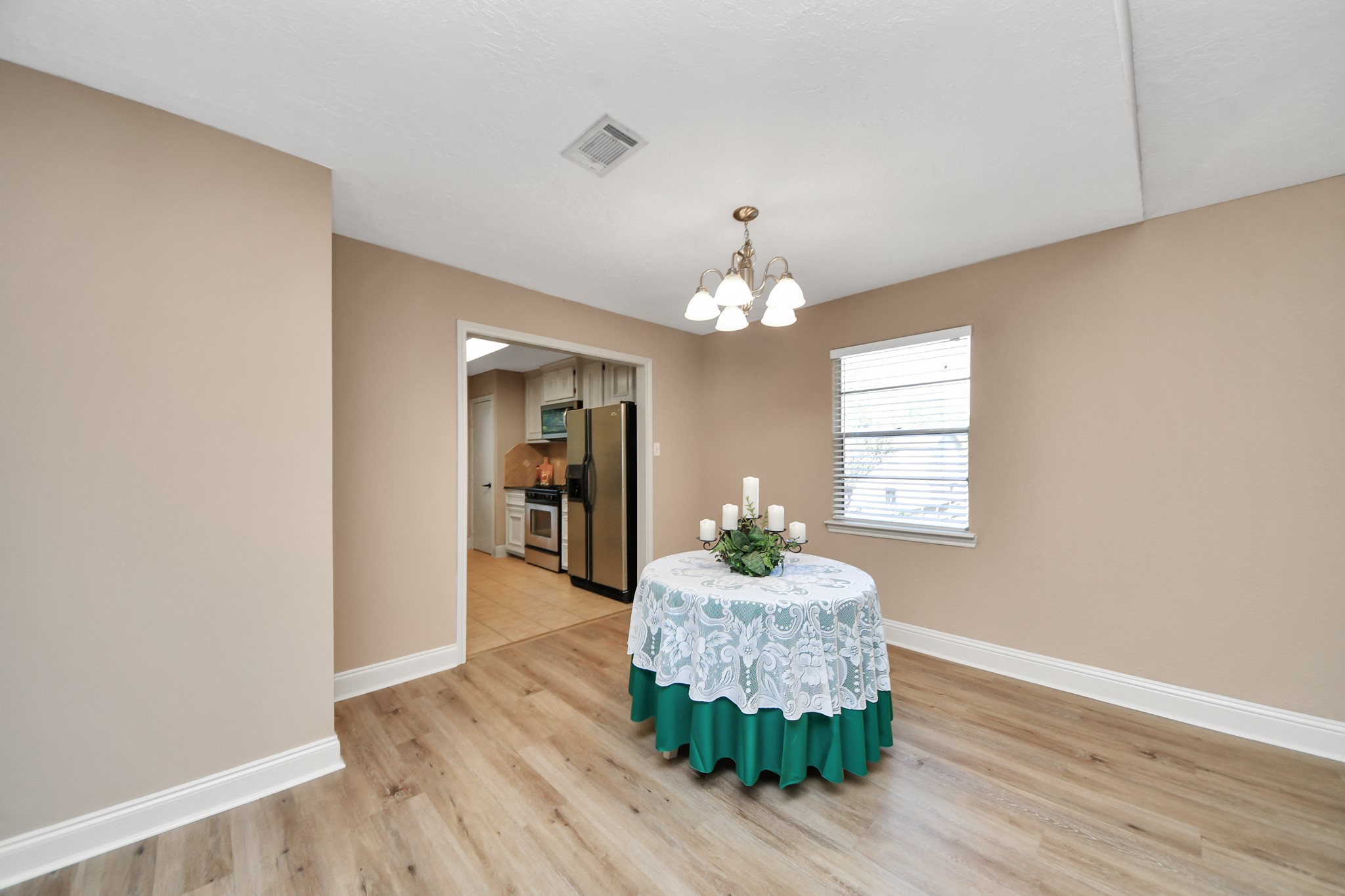Conveniently situated just steps from the kitchen, this dining space makes serving meals and entertaining guests effortless.