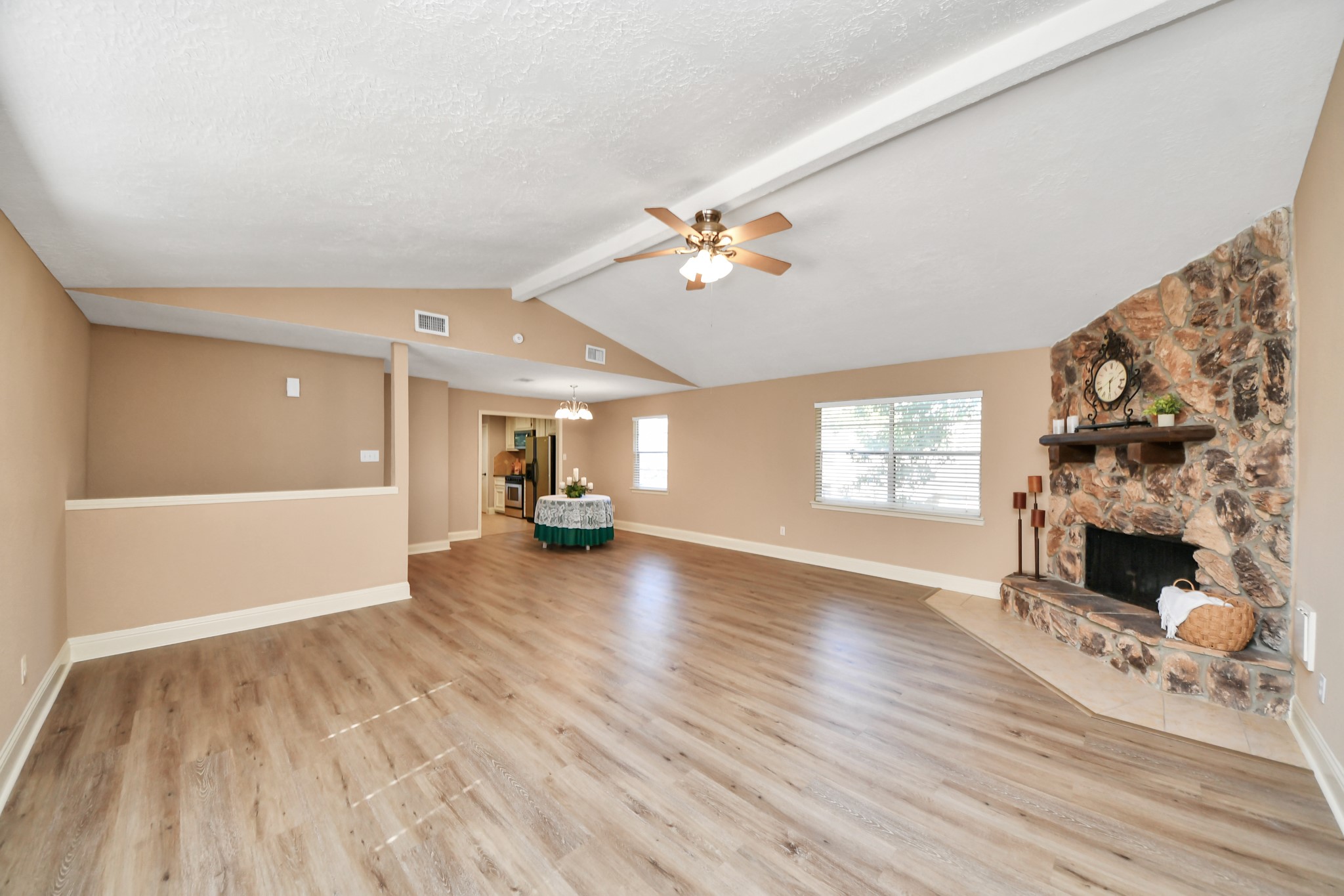 With generous dimensions and attractive wood-look flooring, this room provides the perfect canvas for creating a personalized living environment.