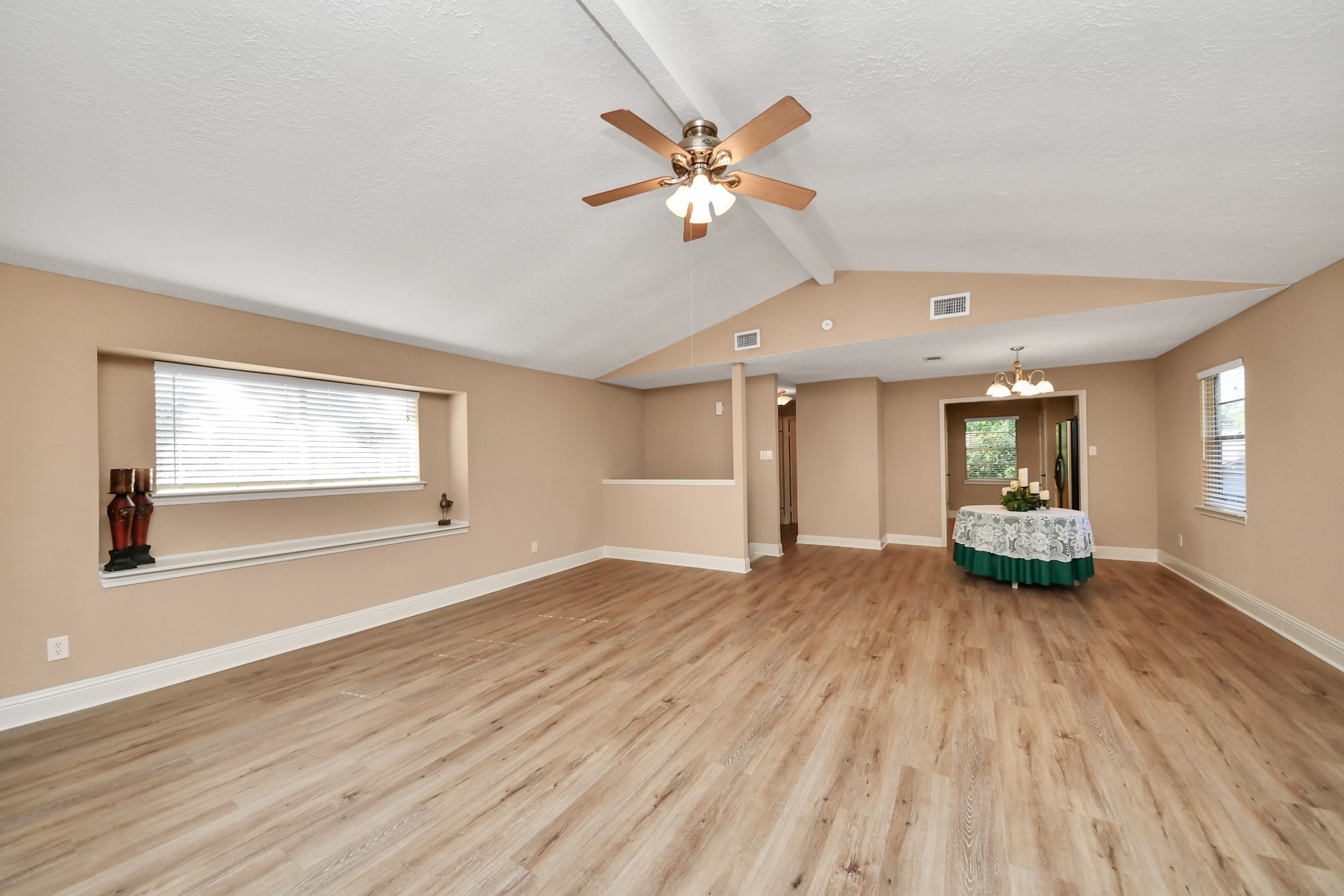 Windows on opposite walls bring natural light into the space, while the extended window ledge offers an opportunity for decorative accents.