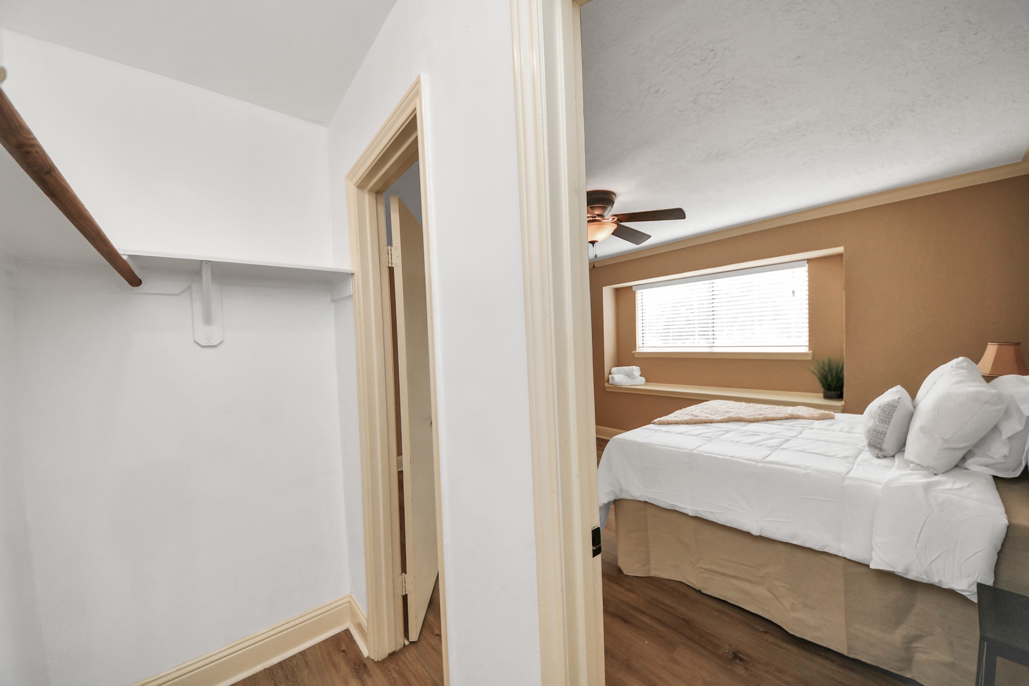 A closer look at the primary bedrooms walk-in closet reveals a dedicated storage area designed to keep everyday essentials conveniently organized.