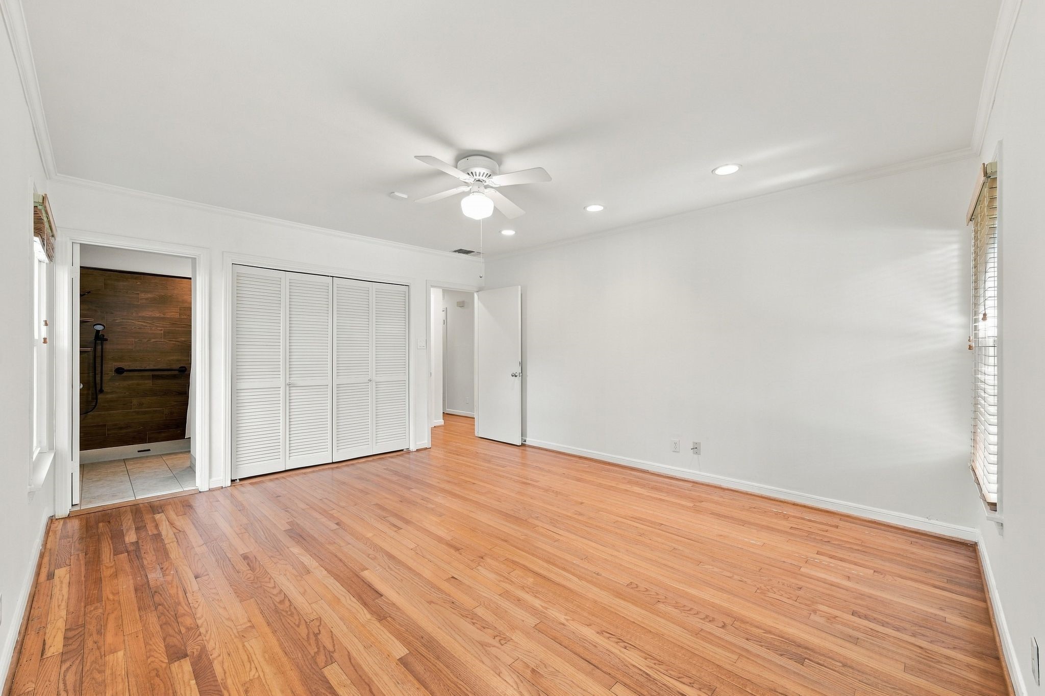 Light filled Primary bedroom has a large closet and opens to bathroom