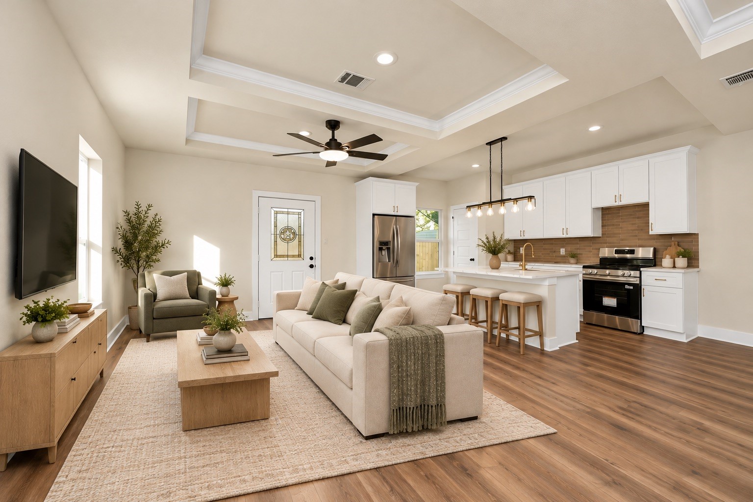 Inviting living room featuring elegant tray ceilings, recessed lighting, ceiling fan, large windows & an open layout designed for comfortable everyday living | Virtually staged