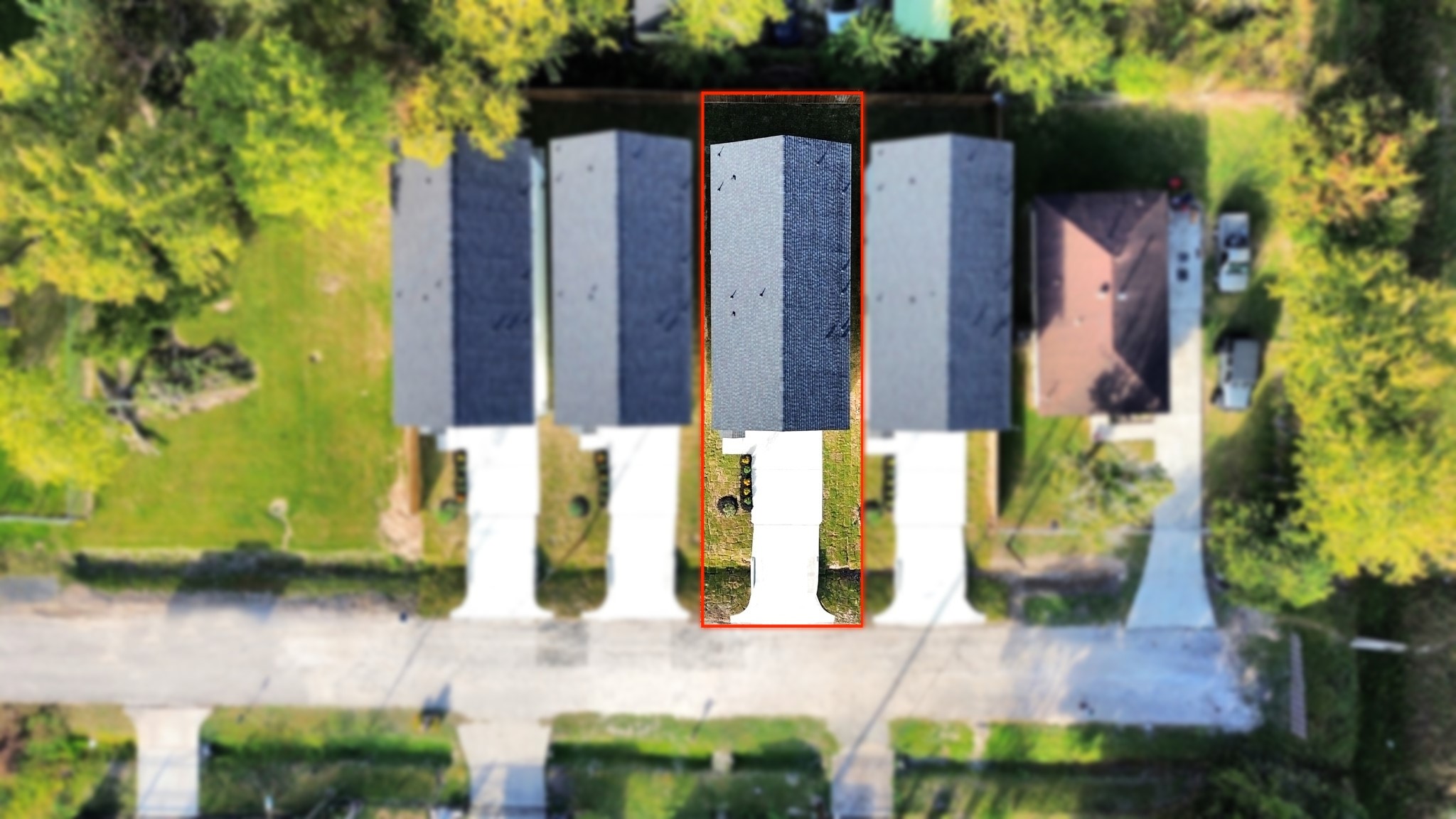 Overhead aerial view showcasing the four newly completed homes at 6671, 6673, 6675 & 6677 Nielan St, highlighting their matching architectural designs, individual driveways & property layouts.
