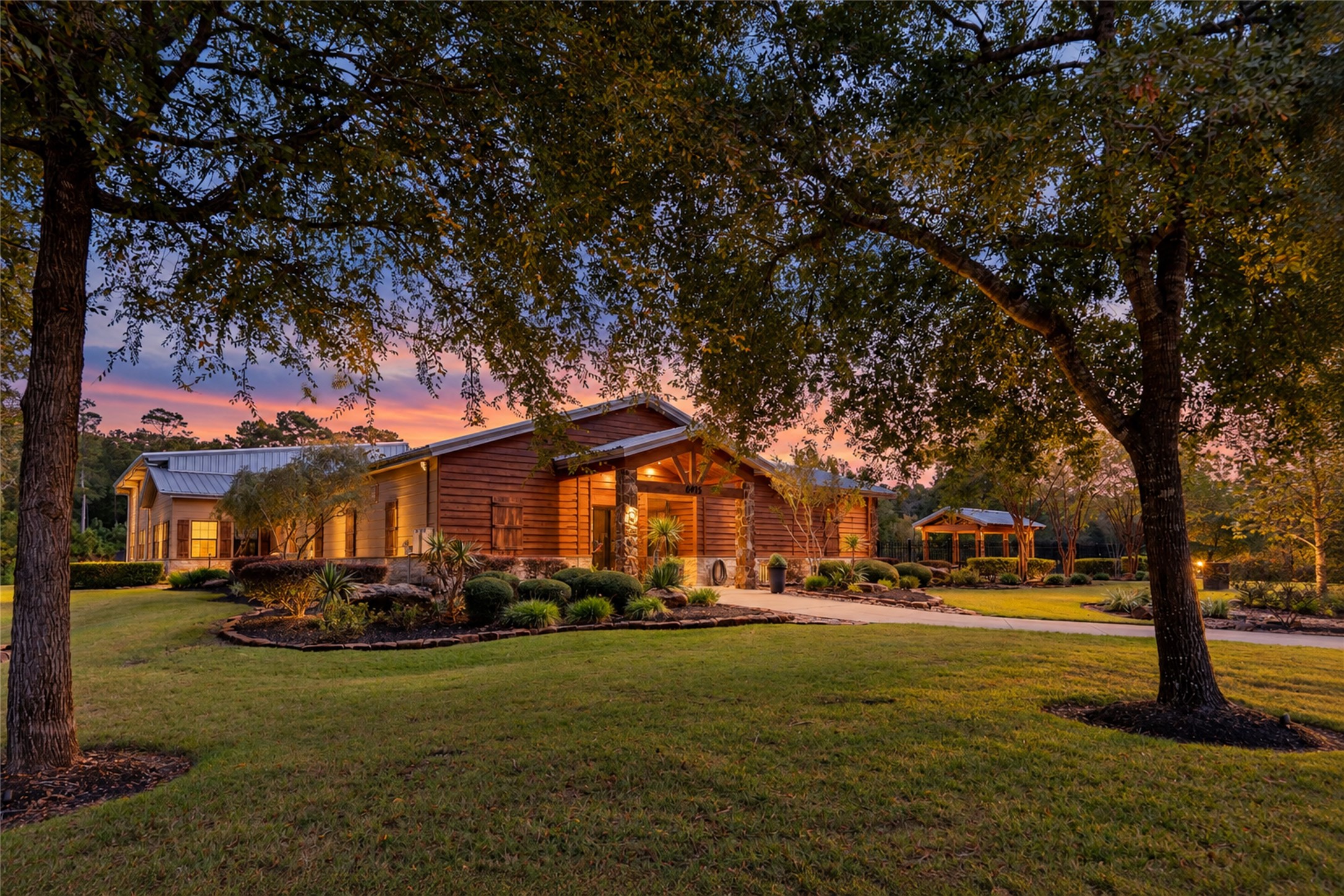 A welcoming covered entrance and landscaped walkway at the community amenity center.