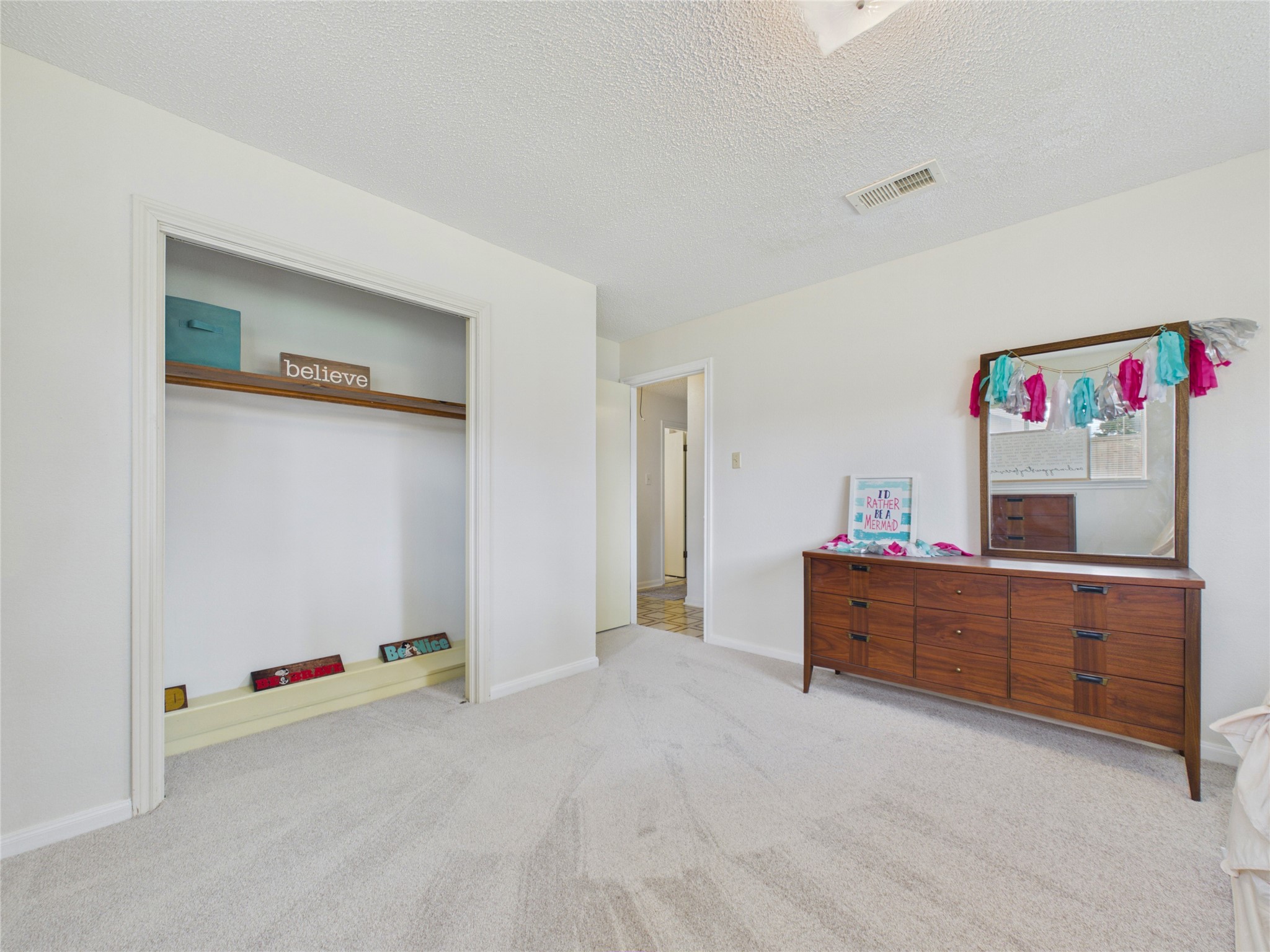 Another view of second bedroom with view out towards the main hallway.