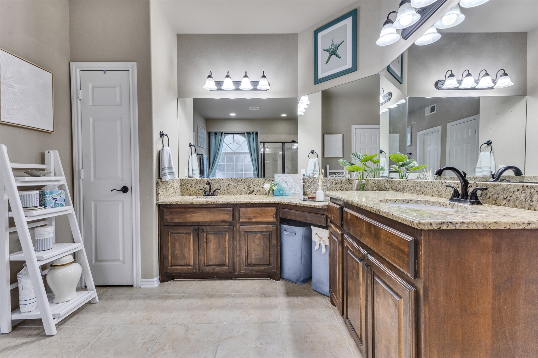 Room for two! Separate vanities with granite countertops make busy mornings a little easier.