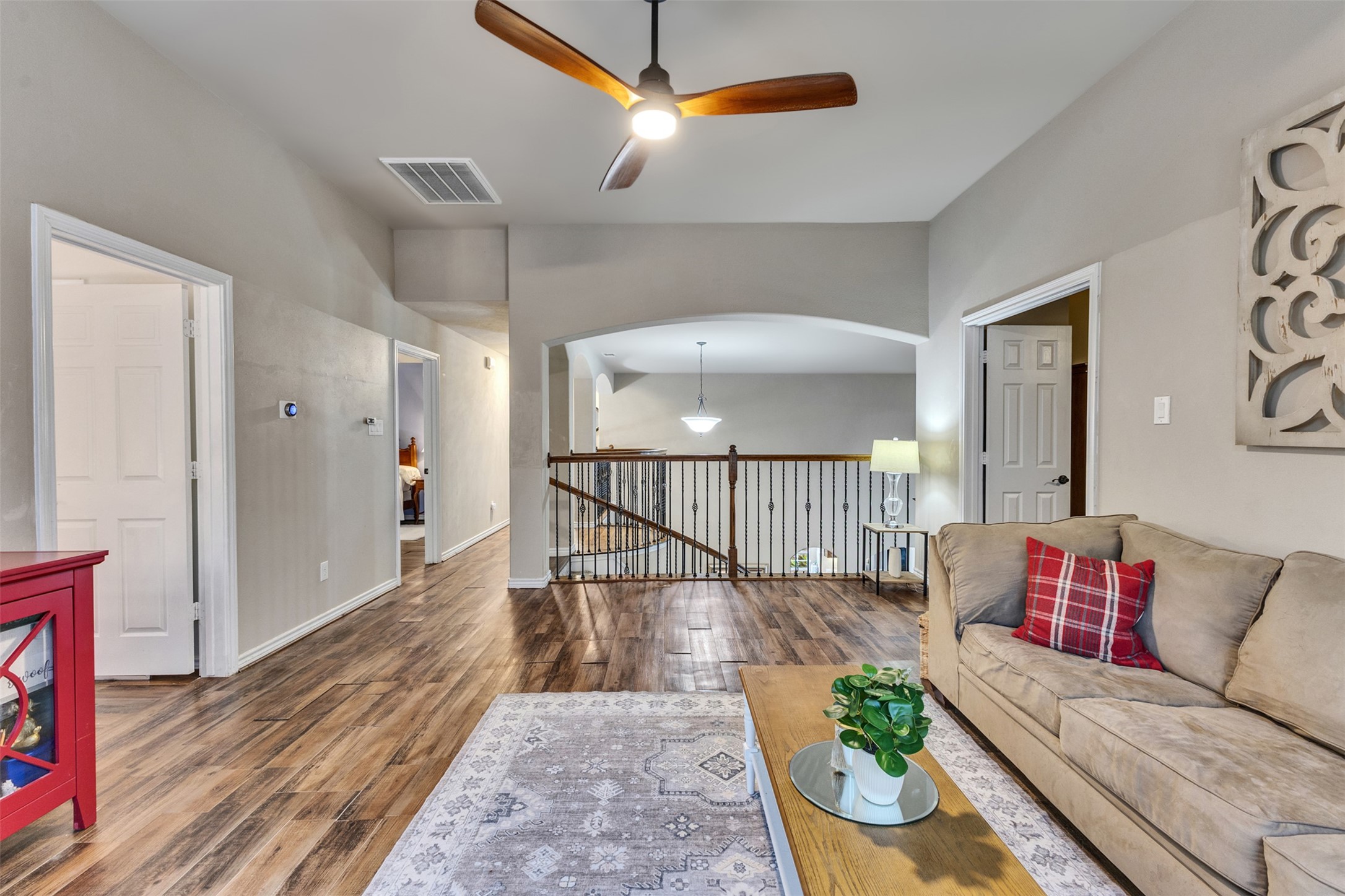 An open upstairs layout connects the game room to the surrounding bedrooms and media room, creating a comfortable space to gather.