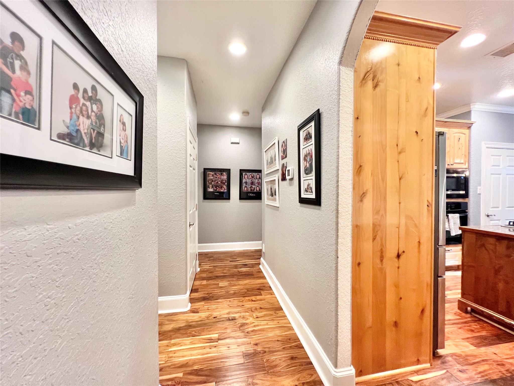 On the opposite side of the home is the hallway to the secondary bedrooms.