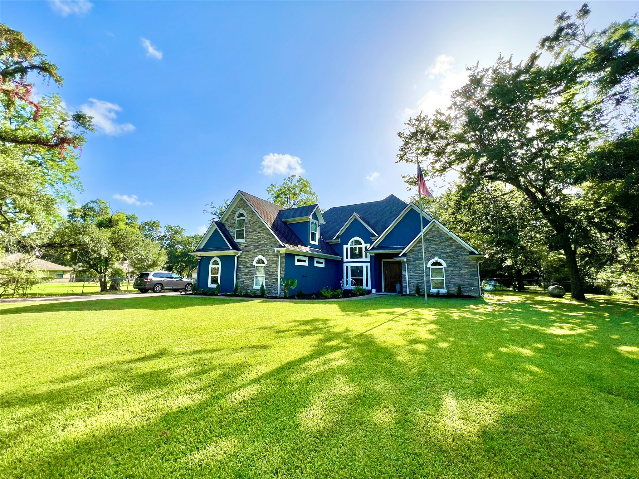 Front yard is impressive but doesn't even compare to the back acreage!