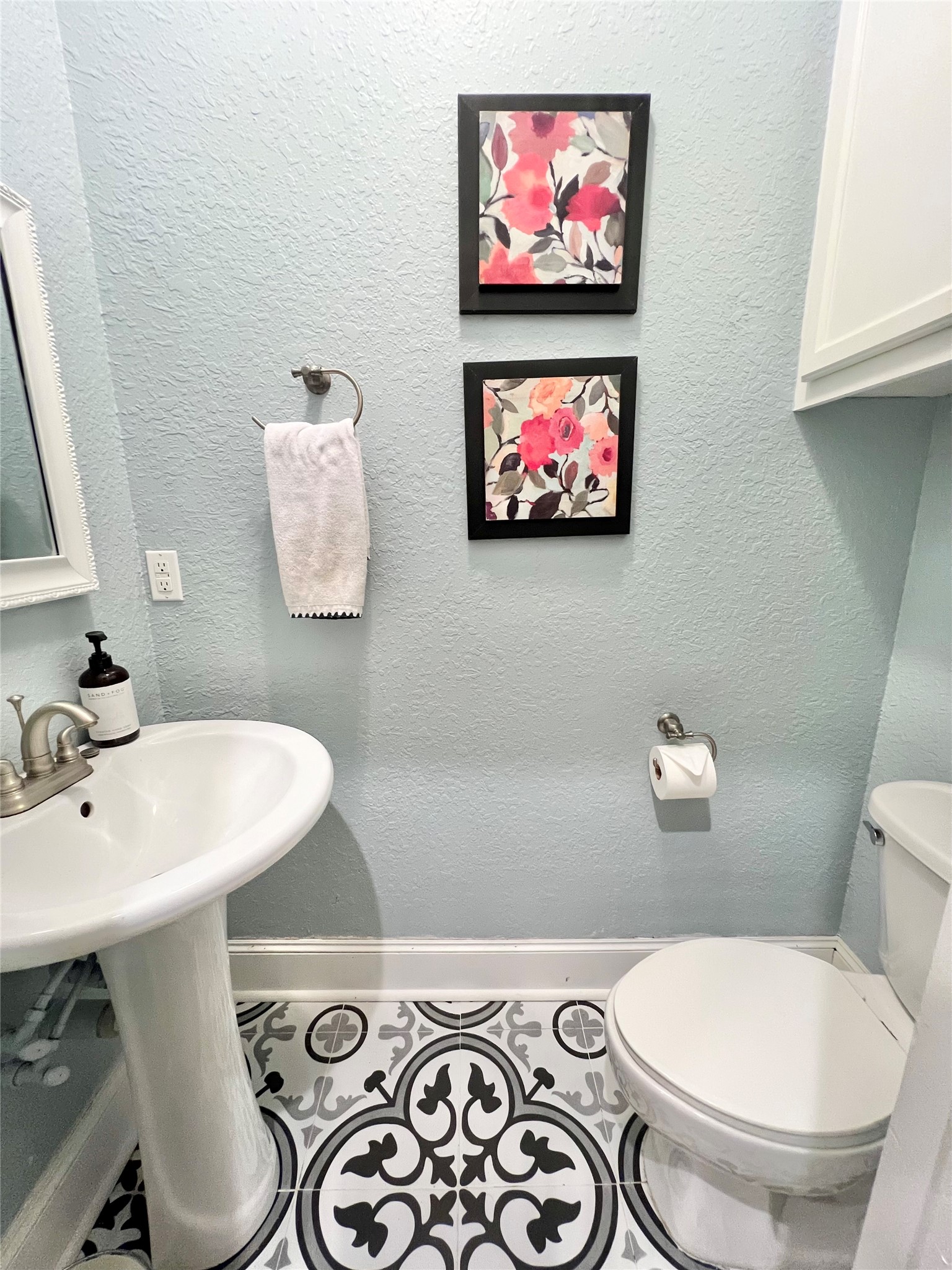 1/2 Bath/Powder Room just off of the Kitchen