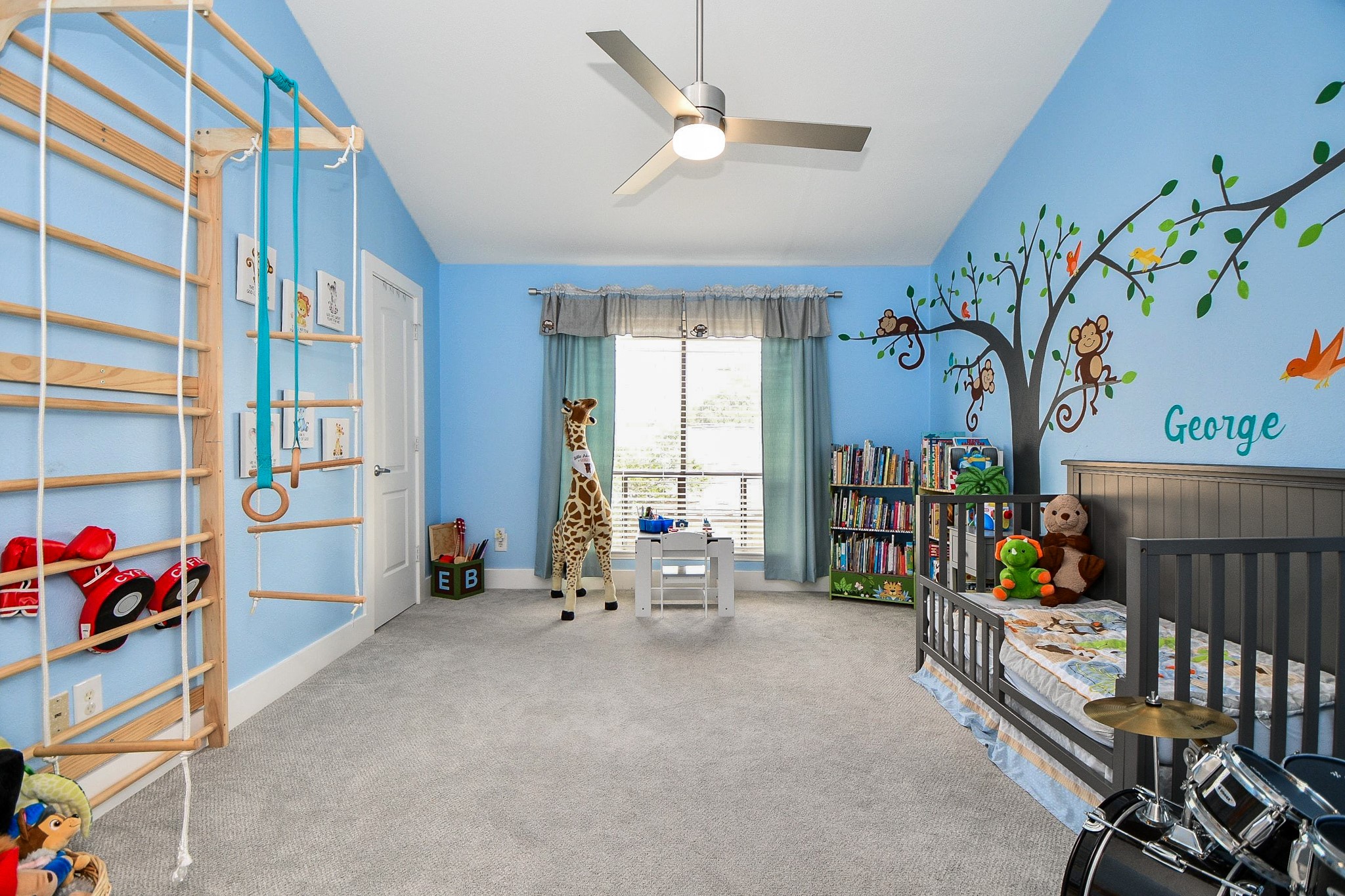 The third bedroom is generously sized with high ceilings and a large window.