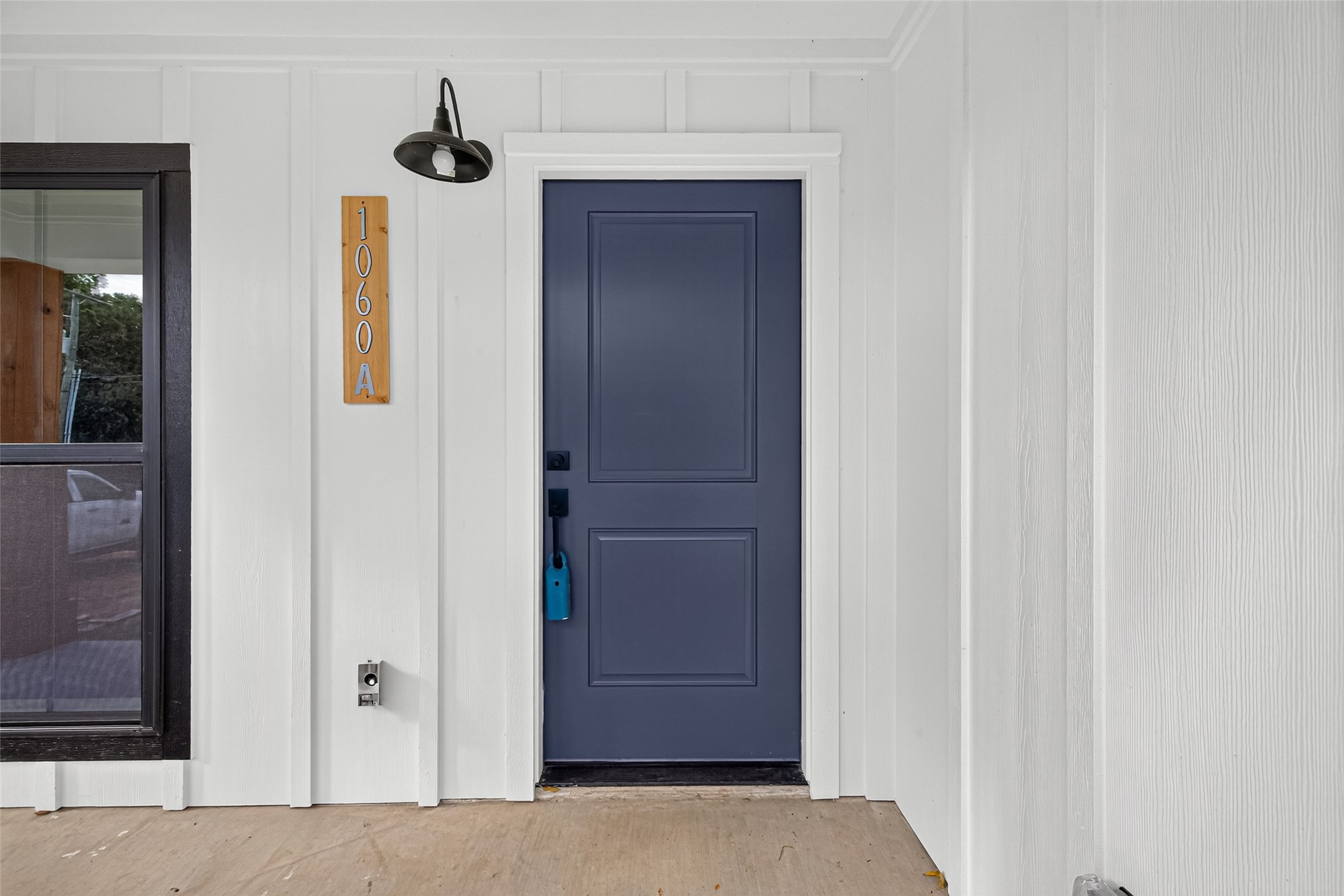 Covered entrance with small patio space to enjoy cooler nights. Covered entrance with small patio space to enjoy cooler nights.