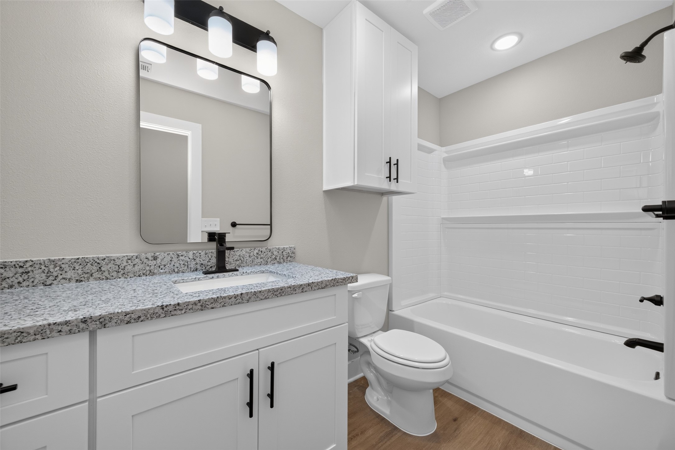 Second bathroom with shower/tub combo.