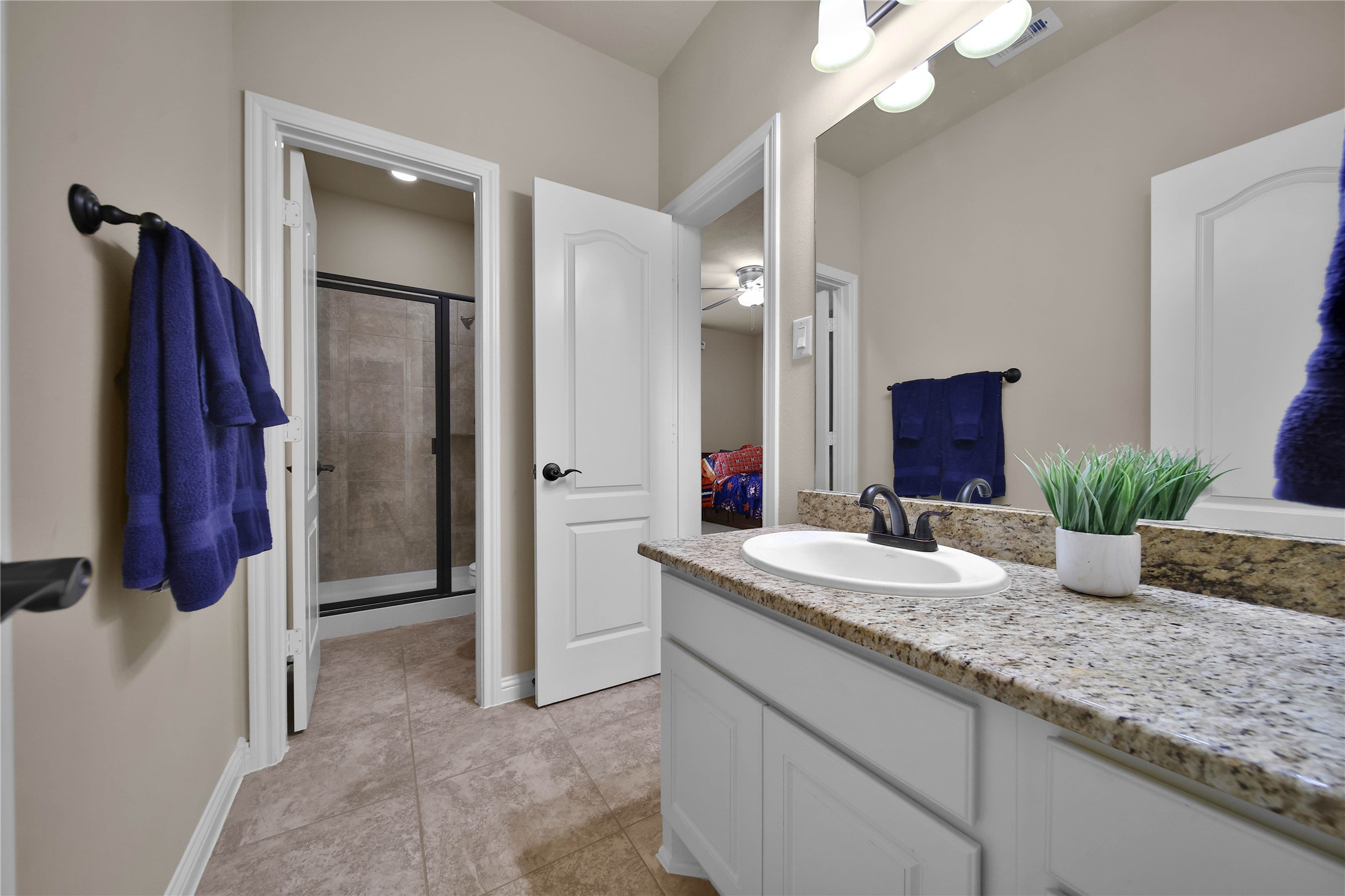 The adjoining bath features an ideal walk-in shower!