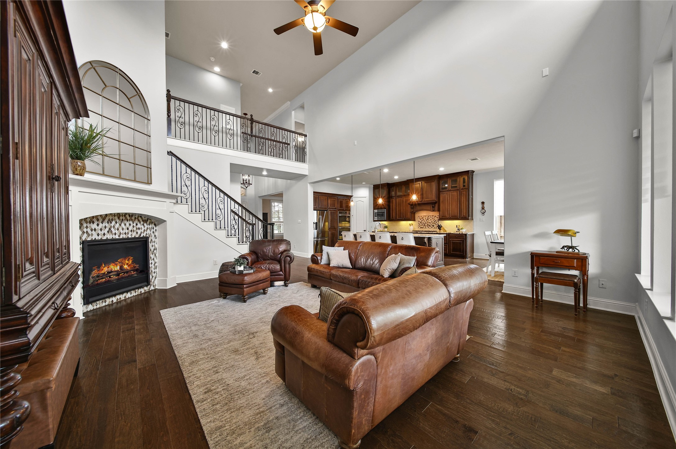 The living room, kitchen, and breakfast area flow seamlessly into one another, creating an inviting open-concept space perfect for everyday living and entertaining.