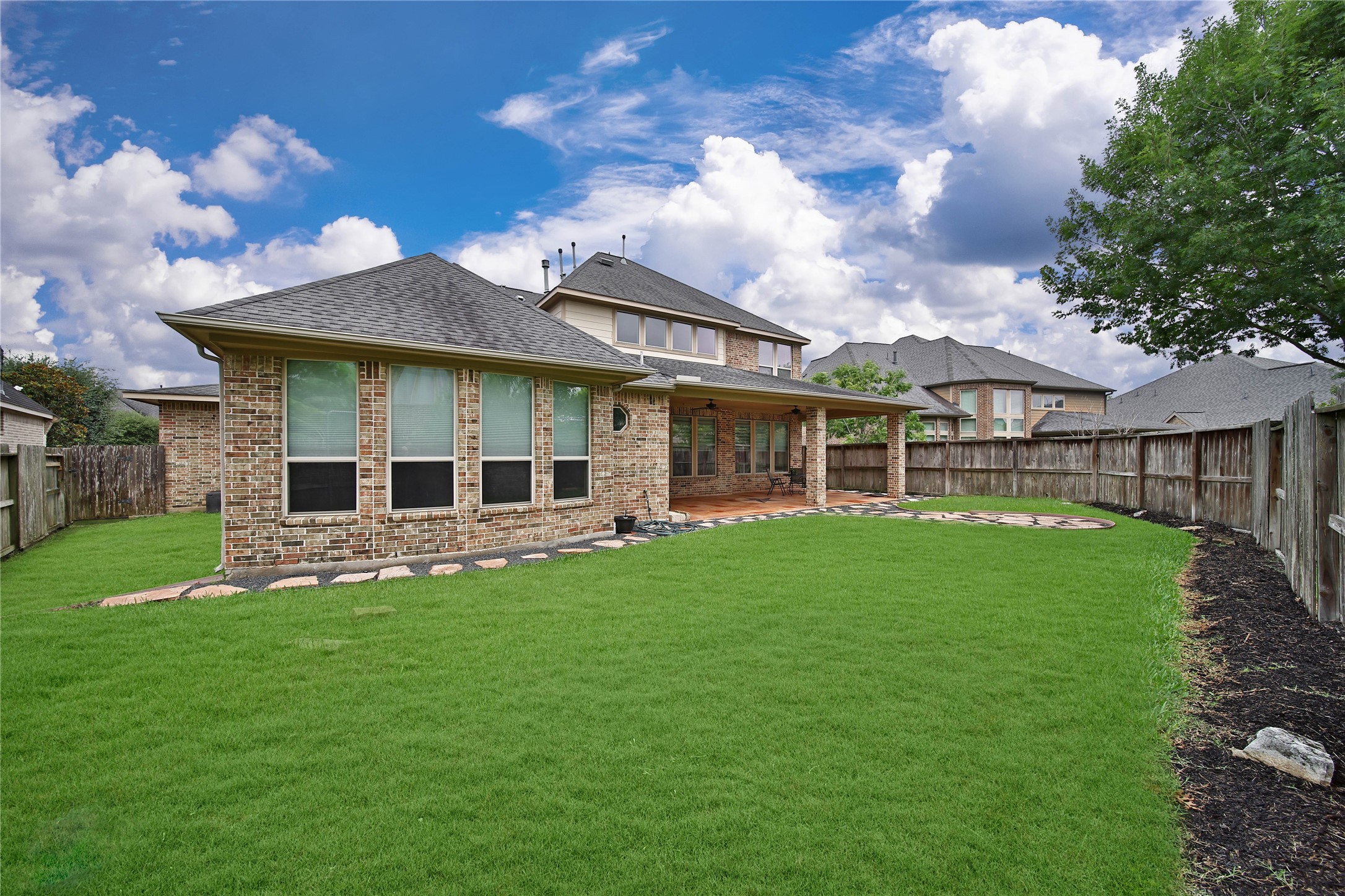 This pool-sized backyard offers plenty of space to create your dream outdoor oasis, whether you envision a pool, play area, or a custom entertaining space. **Note: Seller is happy to remove flagstone/ rocks and resod the backyard with grass if a buyer prefers! **