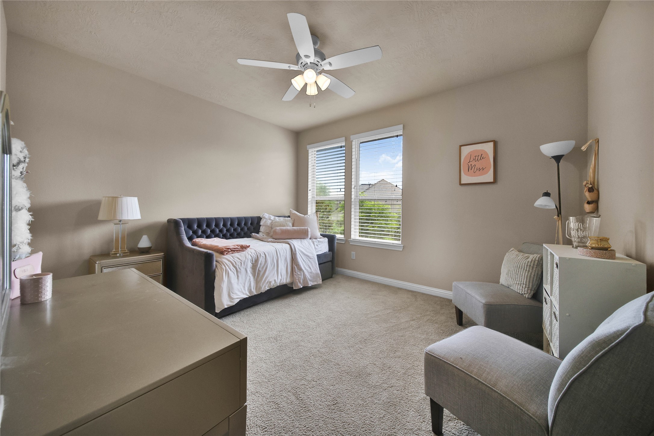 Each upstairs bedroom has a ceiling fan and walk in closet.