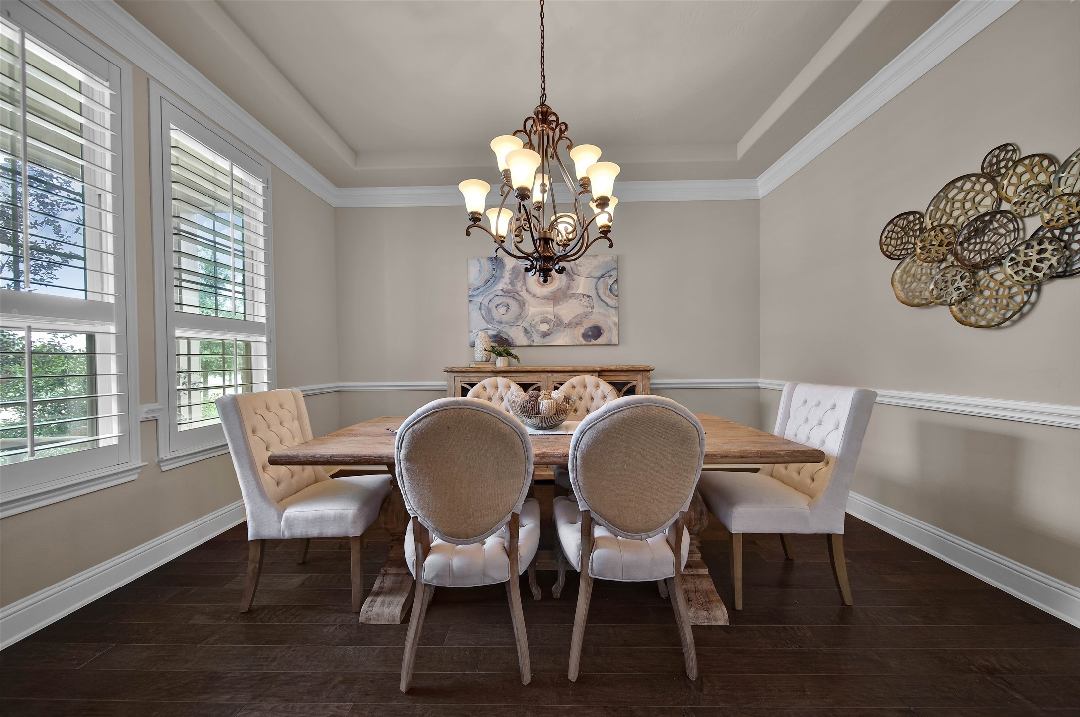 Dine in uncrowded comfort in the elegant dining room, beautifully accented with crown molding and a tray celing for timeless charm.