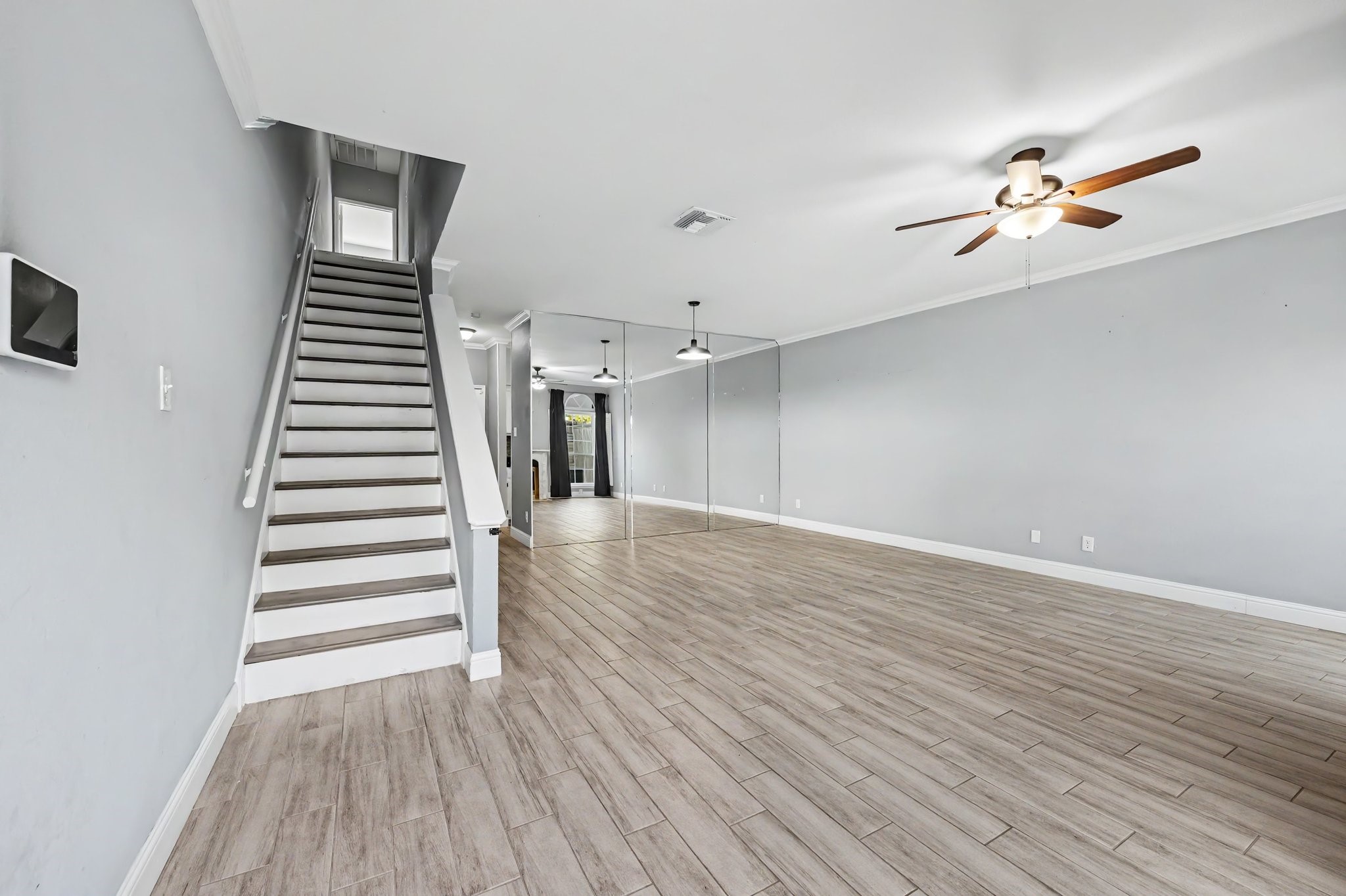View Into Living and Dining Area as You Step in Through the Front Door