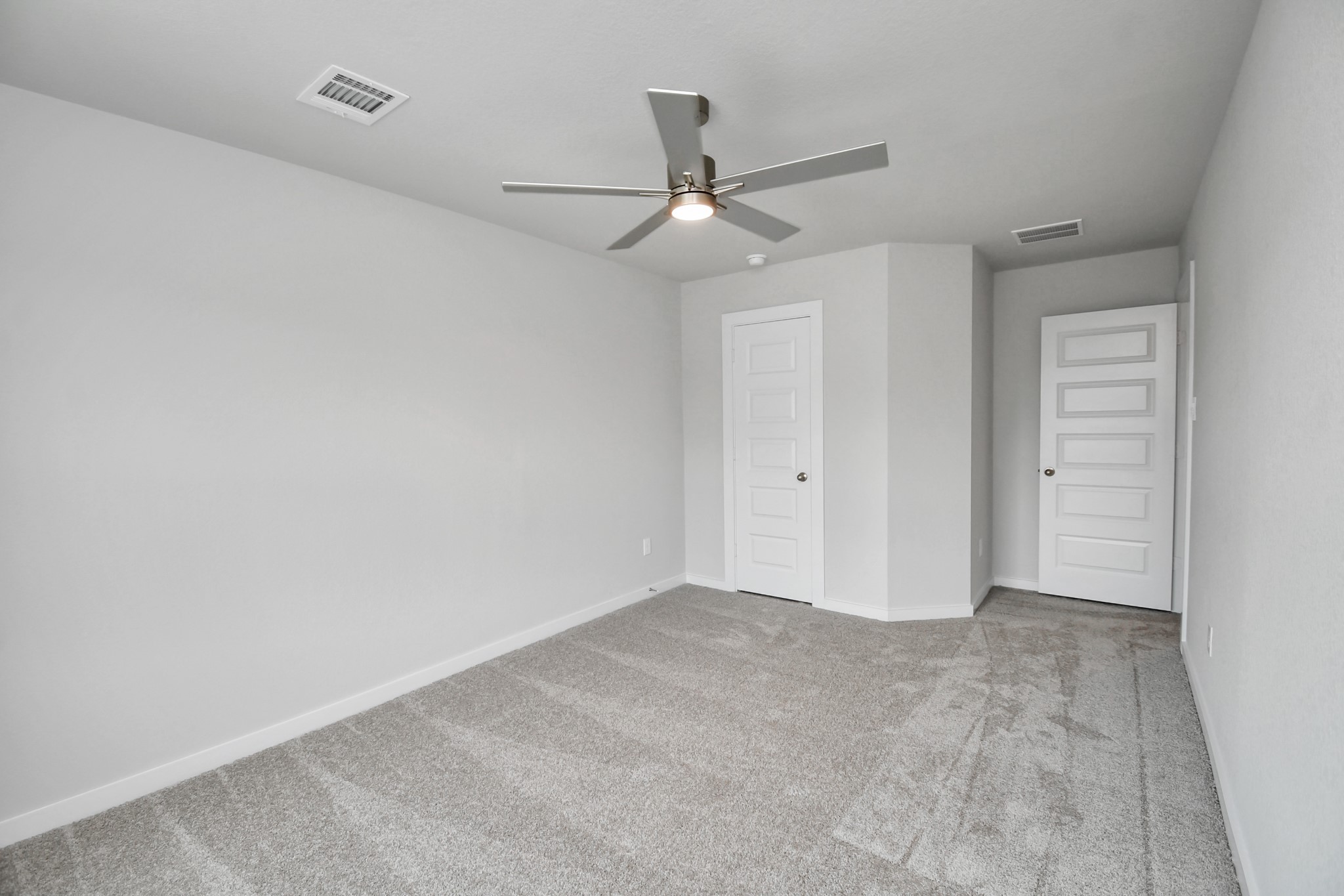 Generously sized secondary bedrooms featuring spacious closets, soft and inviting carpeting underfoot, large windows allowing plenty of natural light, and the added touch of privacy blinds for your personal retreat. Sample photo of completed home with similar floor plan. Actual colors and selections may vary.