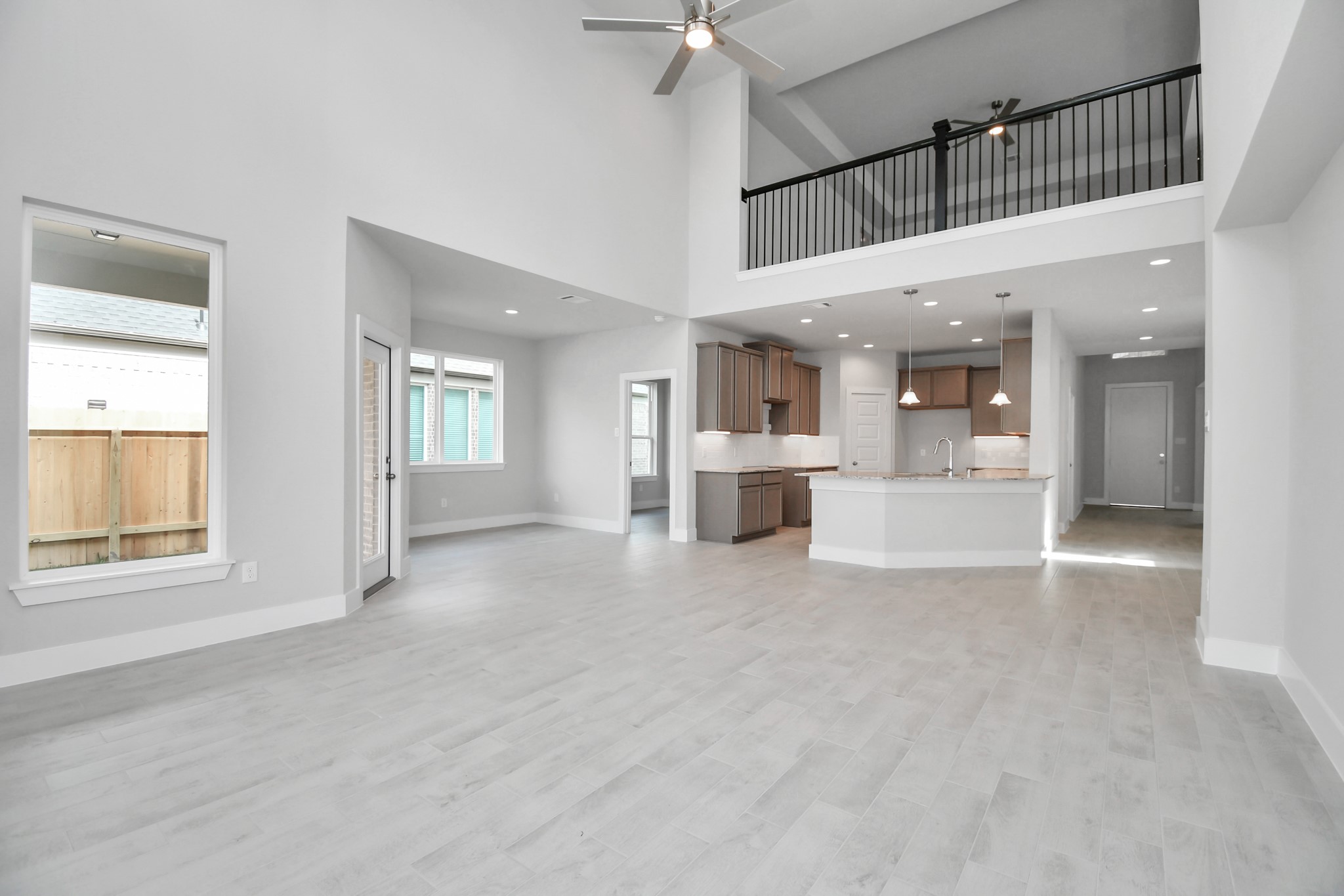 Take another glimpse into the heart of the home with this additional view of the family rooma sprawling space ready to accommodate all your gatherings. Sample photo of completed home with similar floor plan. Actual colors and selections may vary.