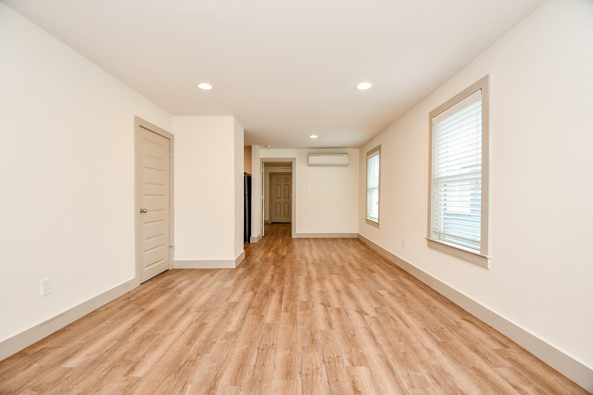 Upstairs 1-bedroom, 1-bathroom unit with private balcony.