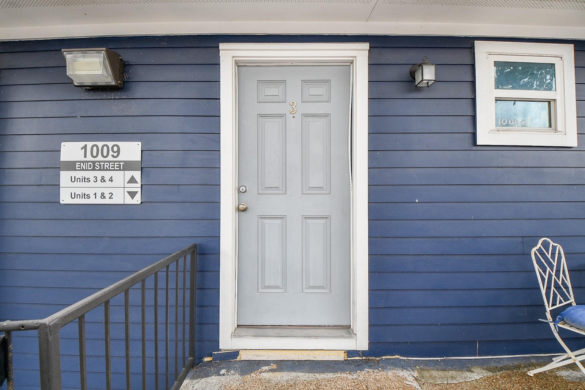 Upstairs 1-bedroom, 1-bathroom unit with private balcony.