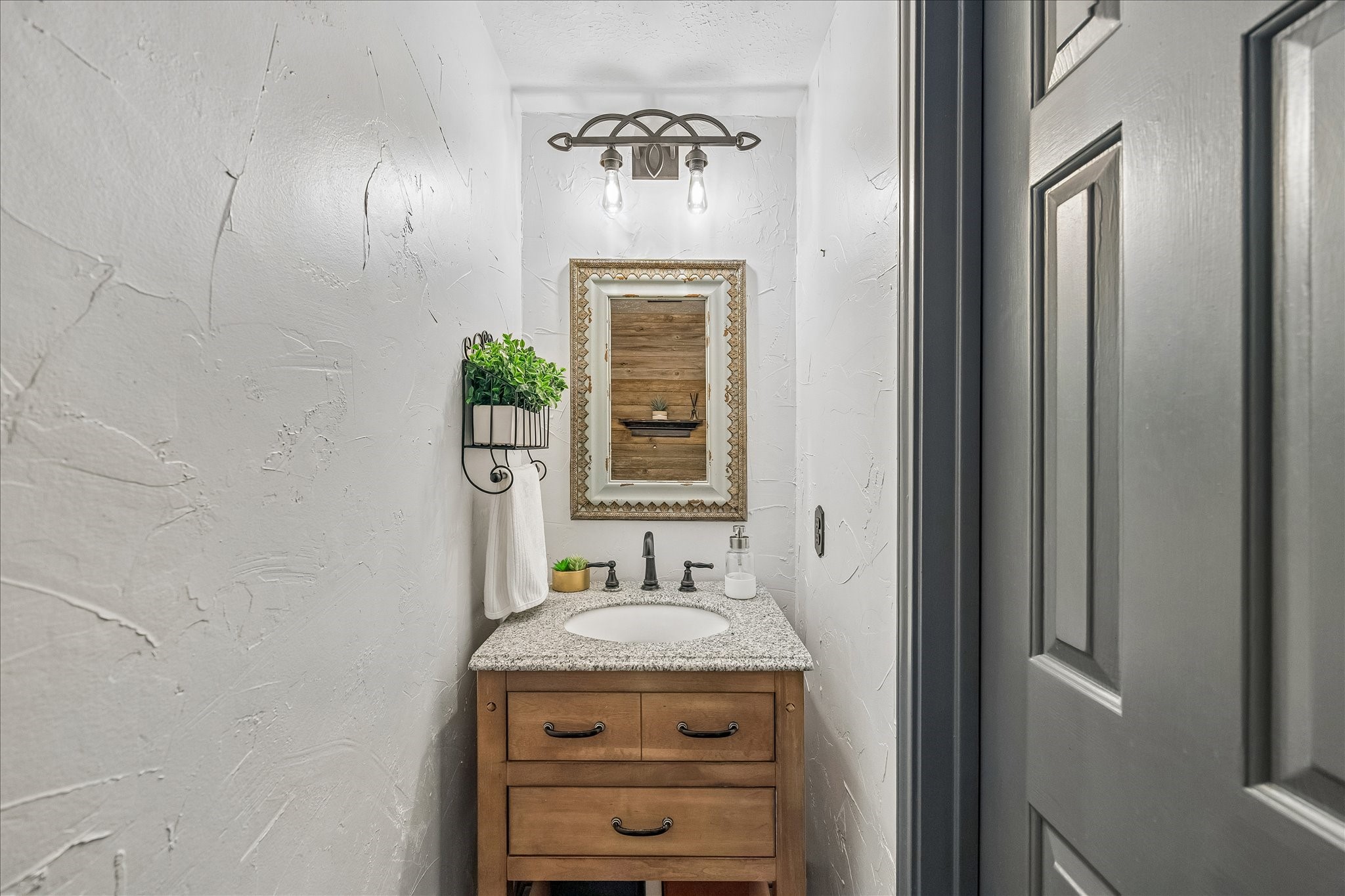 Half bath is downstairs and uniquely decorated