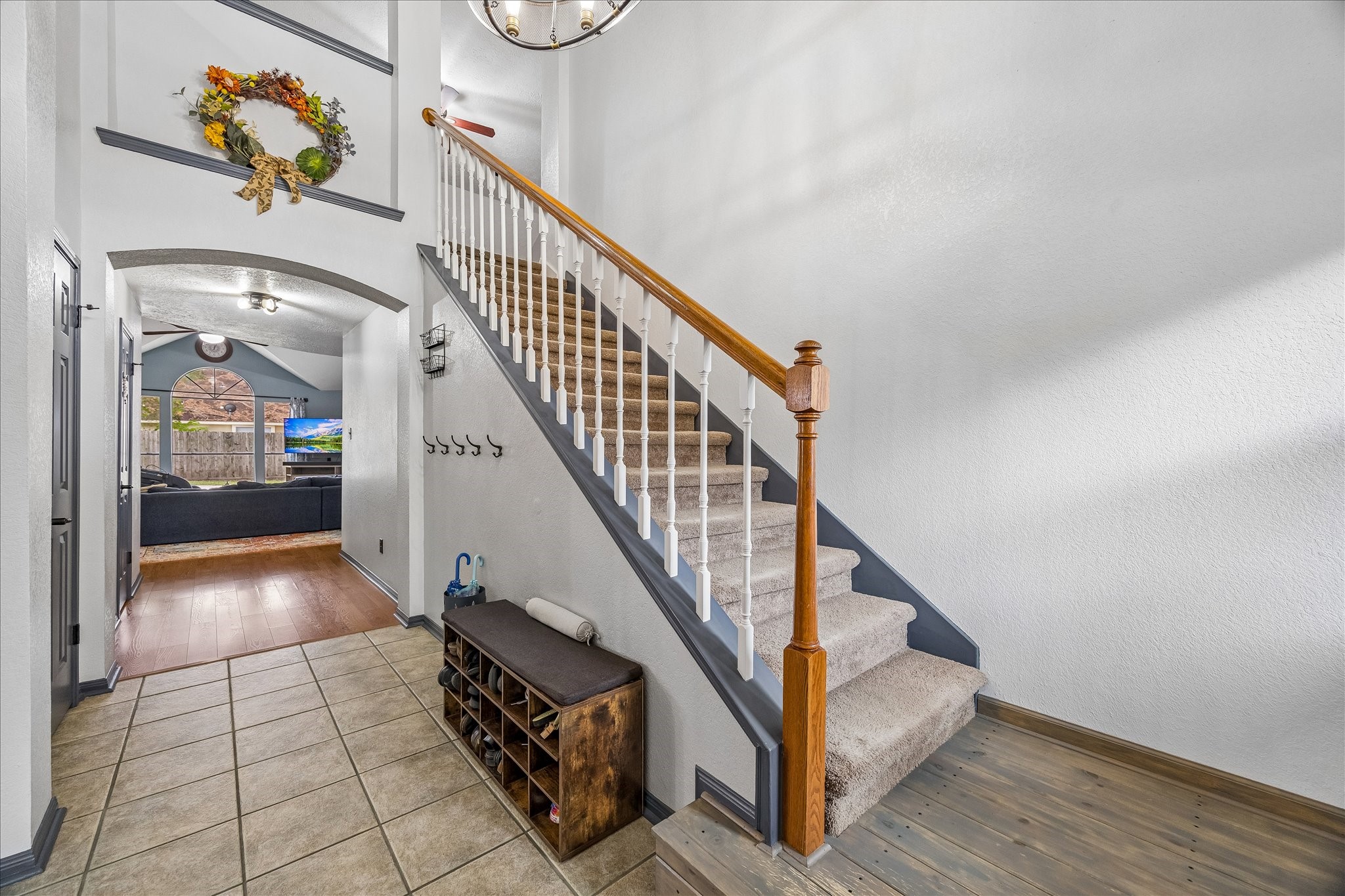 The floor, stairs w/landing, curved arched high doorway