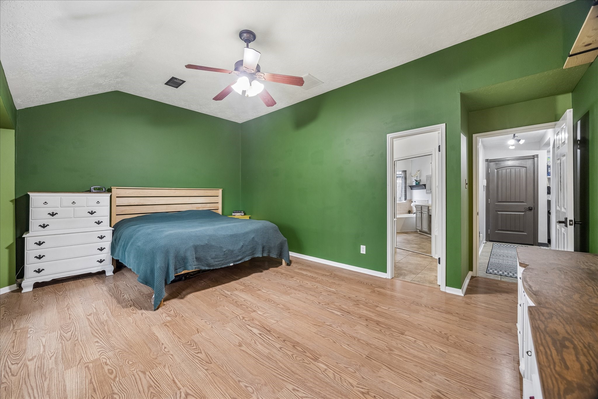 The primary bedroom is HUGE with lots of natural light