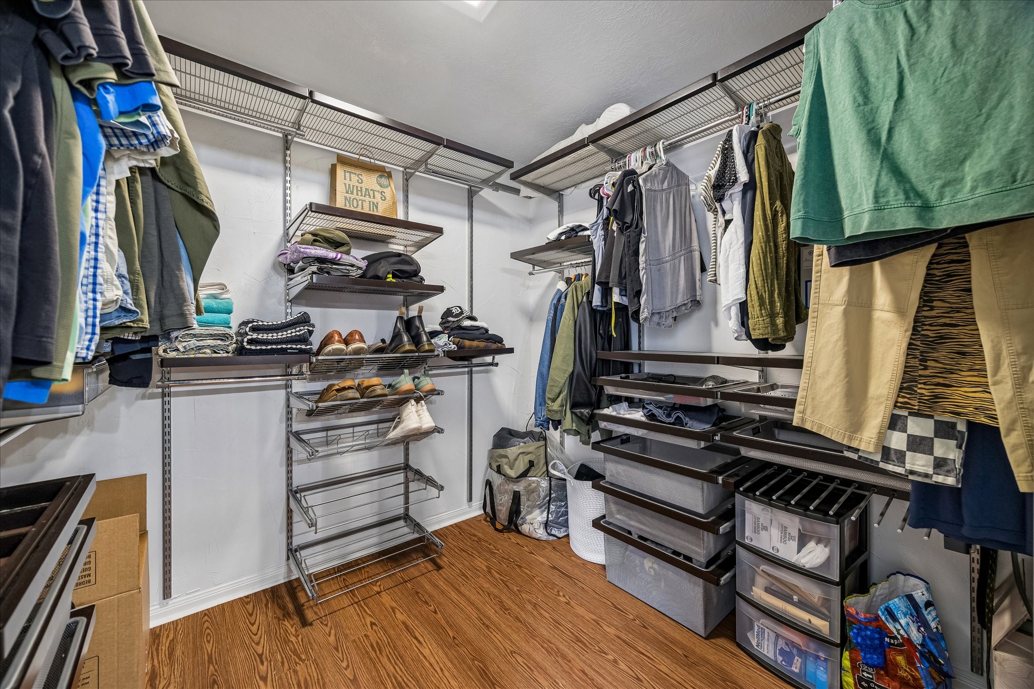 Look at this large primary closet with lots of options & beautiful floors, floor to ceiling sliding mirrored doors
