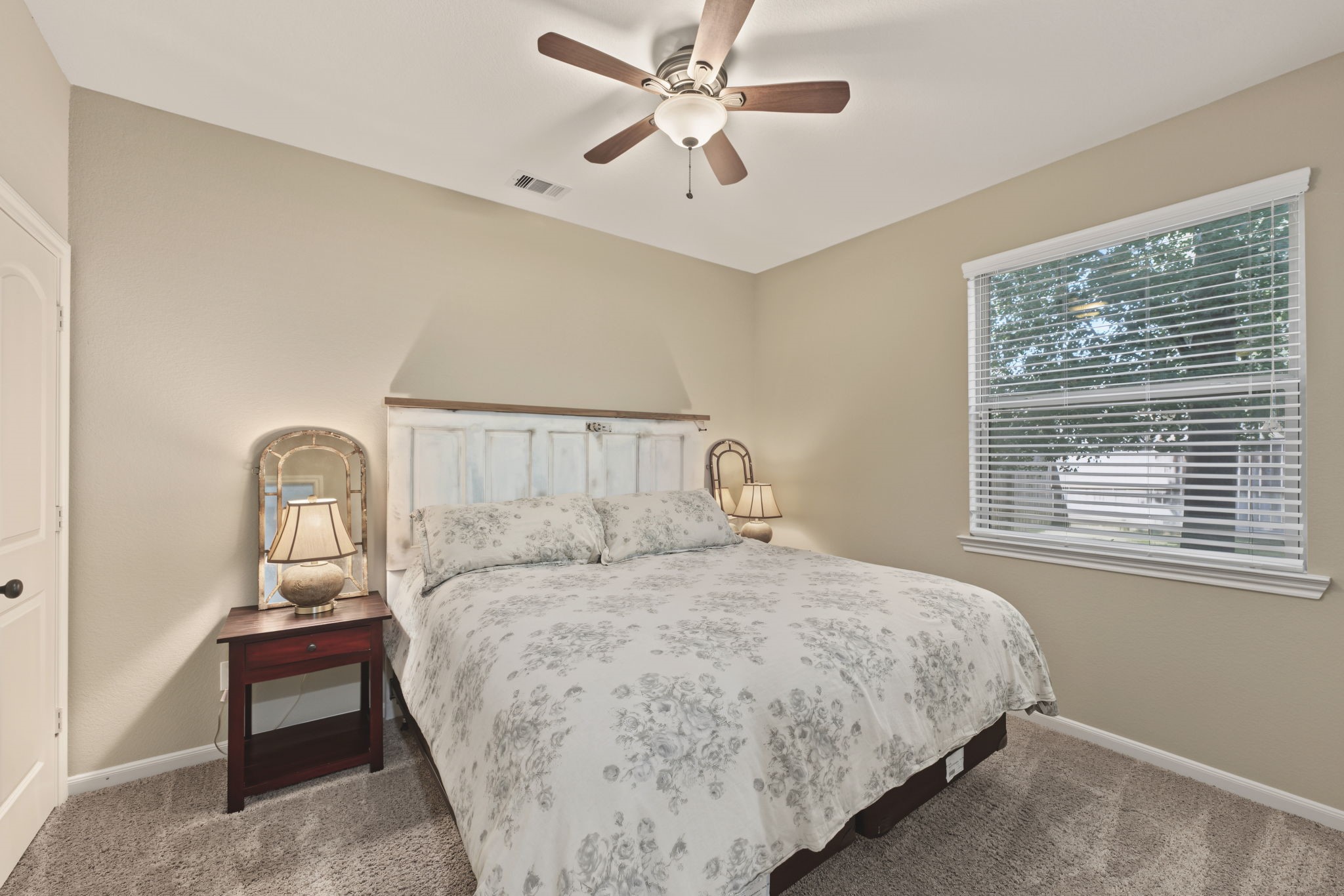 Unwind in this peaceful bedroom that is at the rear of the home overlooking the backyard . Featuring soft neutral tones, a walk in closet and a window that brings natural light into your personal retreat.