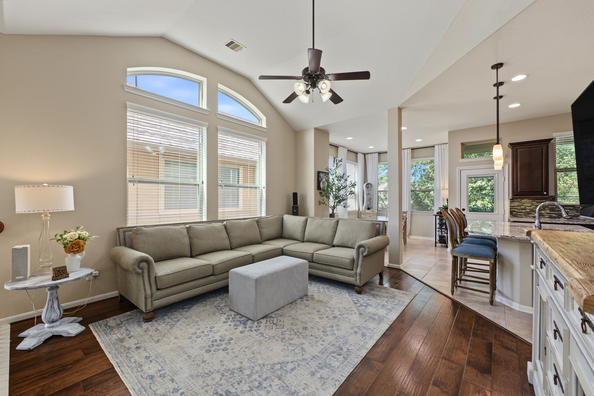 This home has lots of large windows which makes it feel very open, bright.  The sun beams off of the beautiful wood floors.  This spacious living area is designed for effortless everyday living and memorable gatherings.