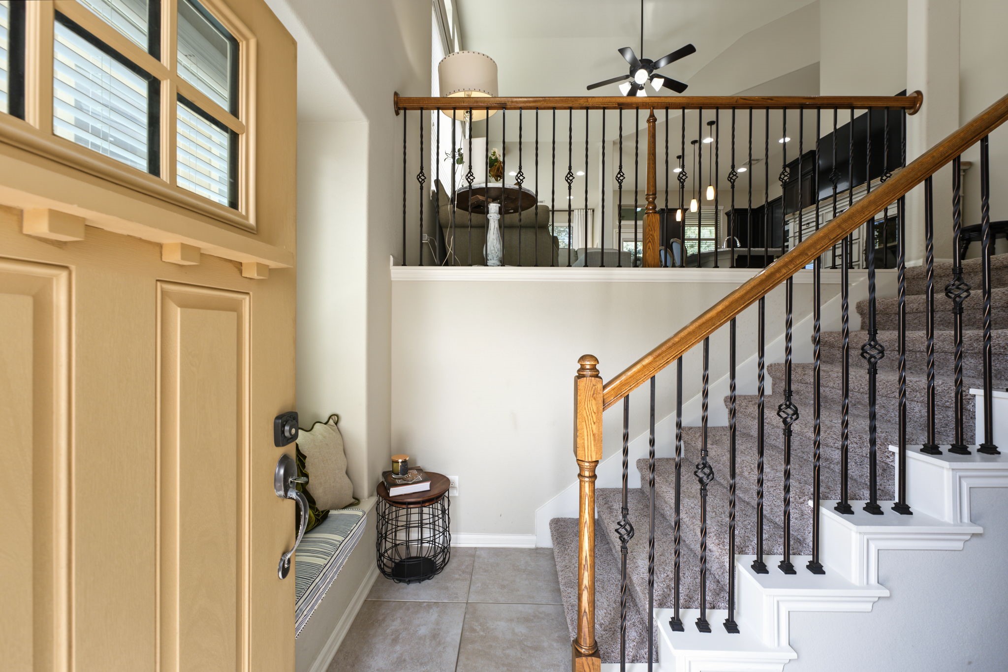 As you enter the home you can go upstairs to the main living areas or downstairs to the secondary bedrooms.