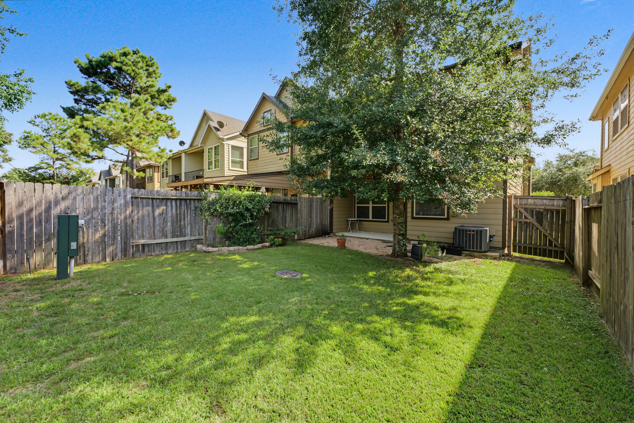 This cozy backyard is low maintenance, but completely fenced in for privacy.