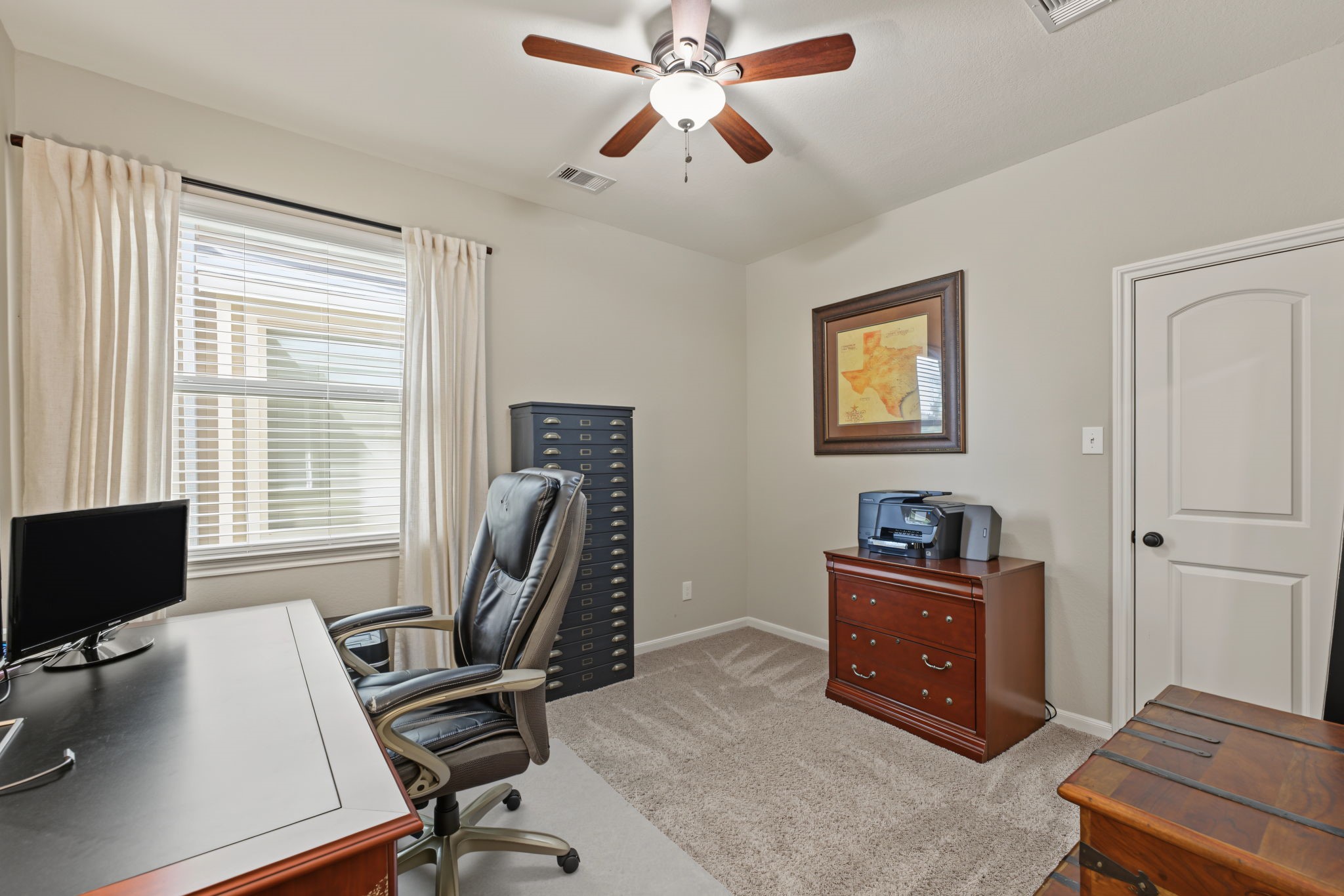 Bedroom #2 is currently being used as a home office. With a walk in closet.