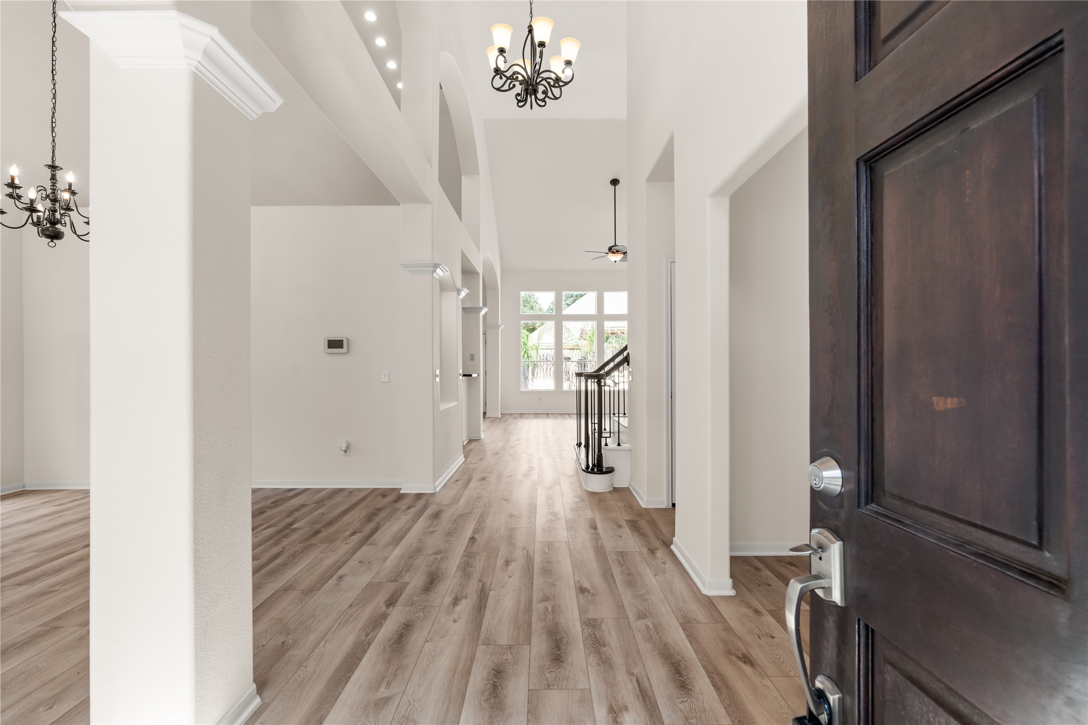 Entry boasting with natural light and high ceilings.